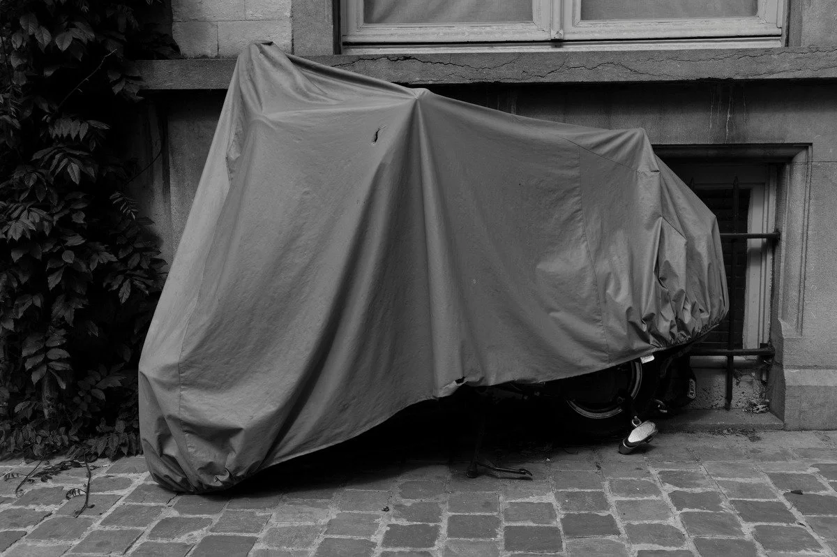 Photograph of a vehicle covered for protection