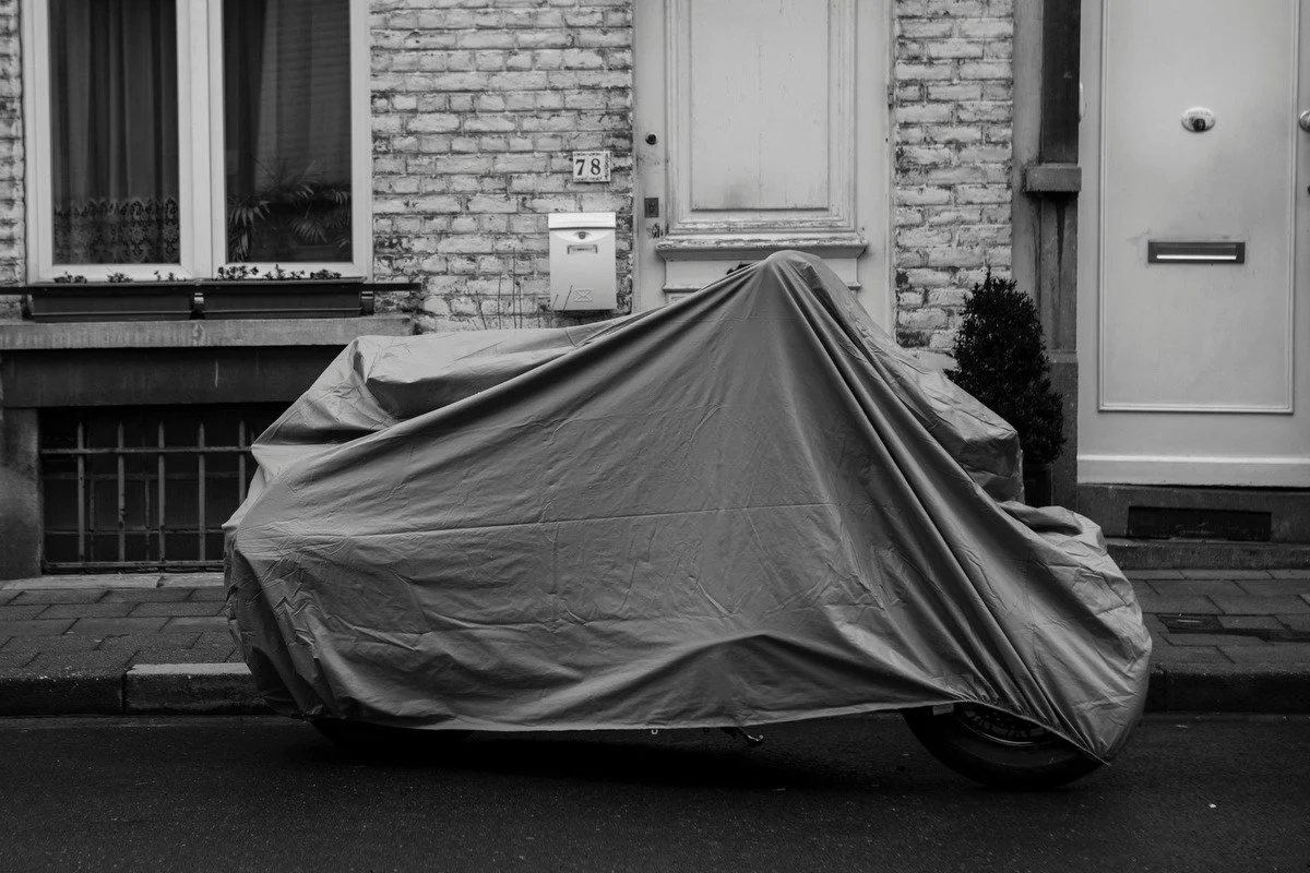 Photograph of a vehicle covered for protection