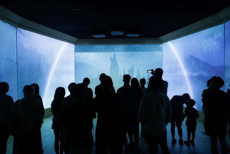 event photo of people in front of a projection