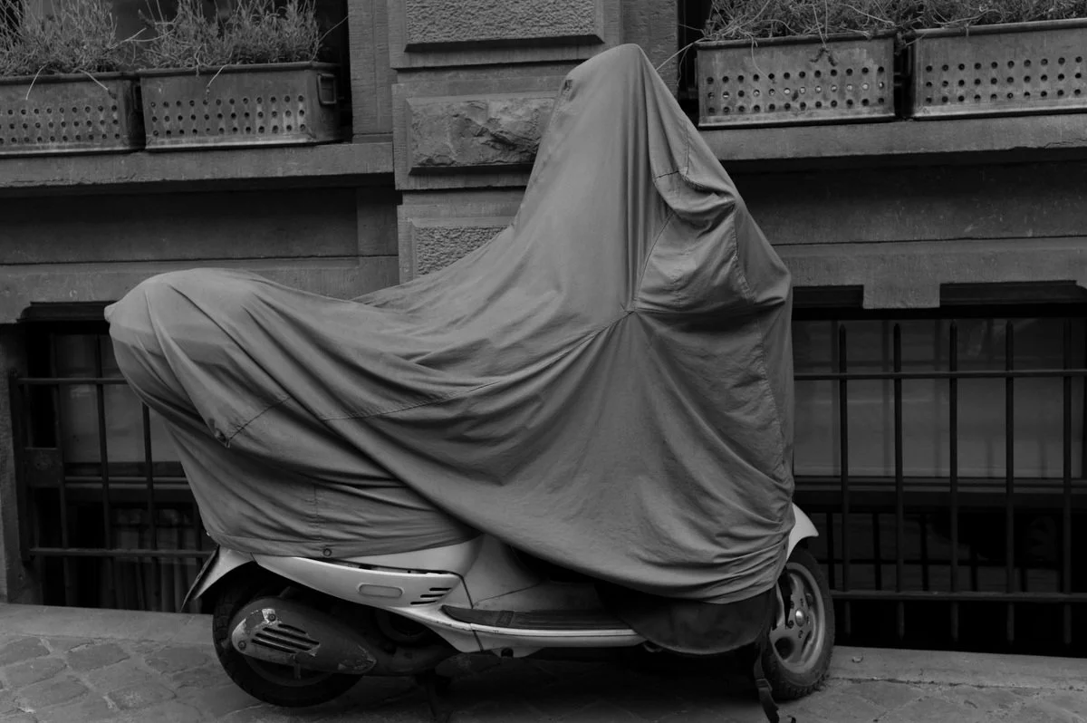 Photograph of a vehicle covered for protection