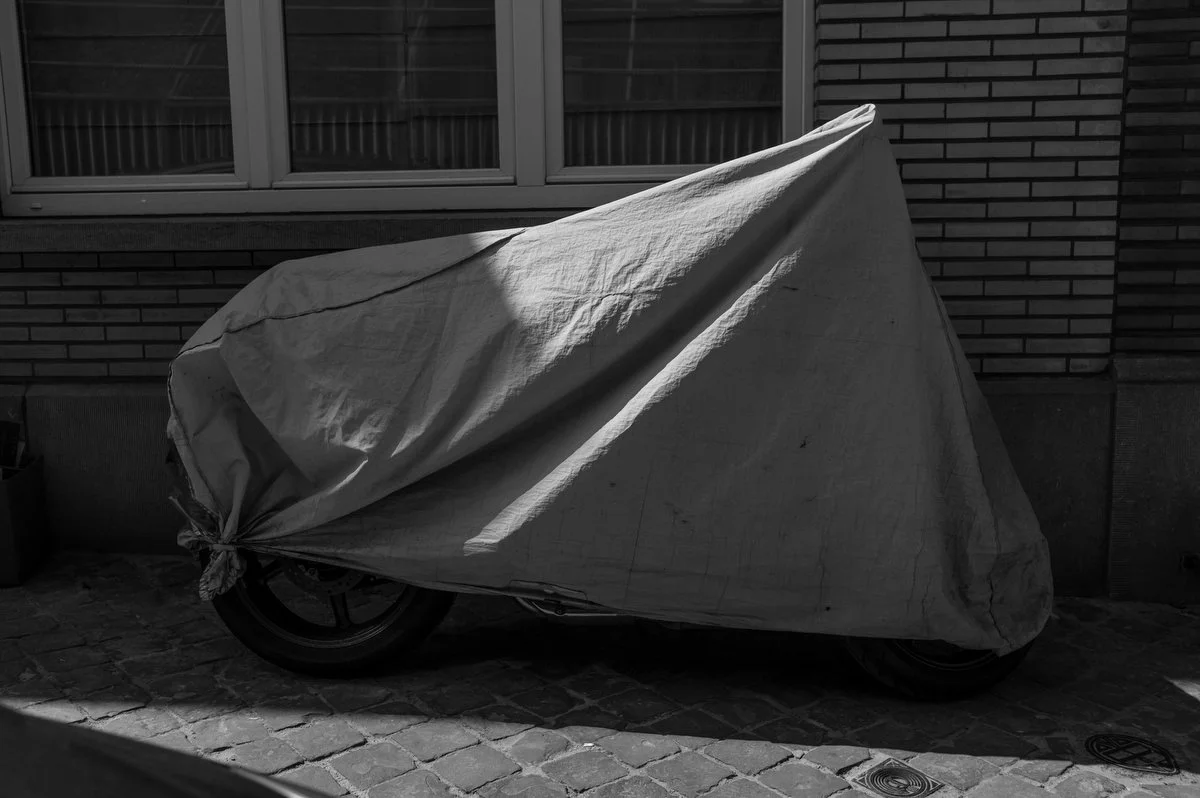 Photograph of a vehicle covered for protection