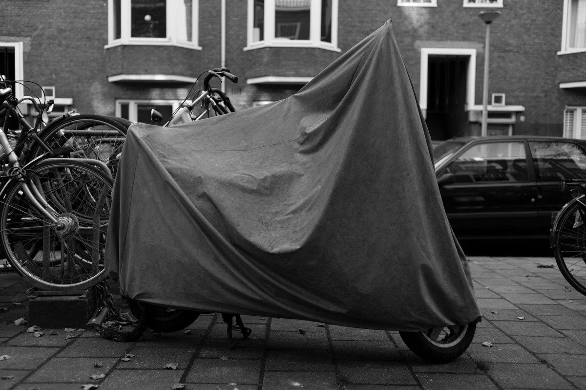 Photograph of a vehicle covered for protection
