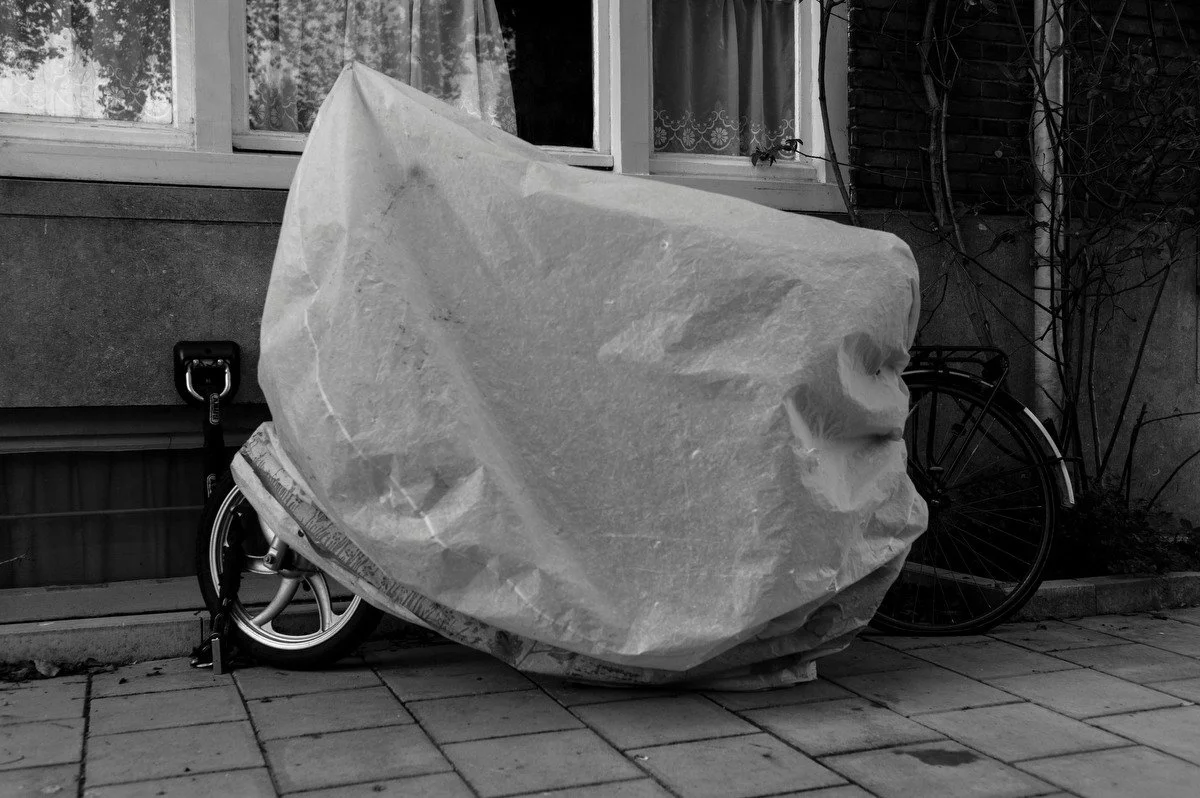 Photograph of a vehicle covered for protection