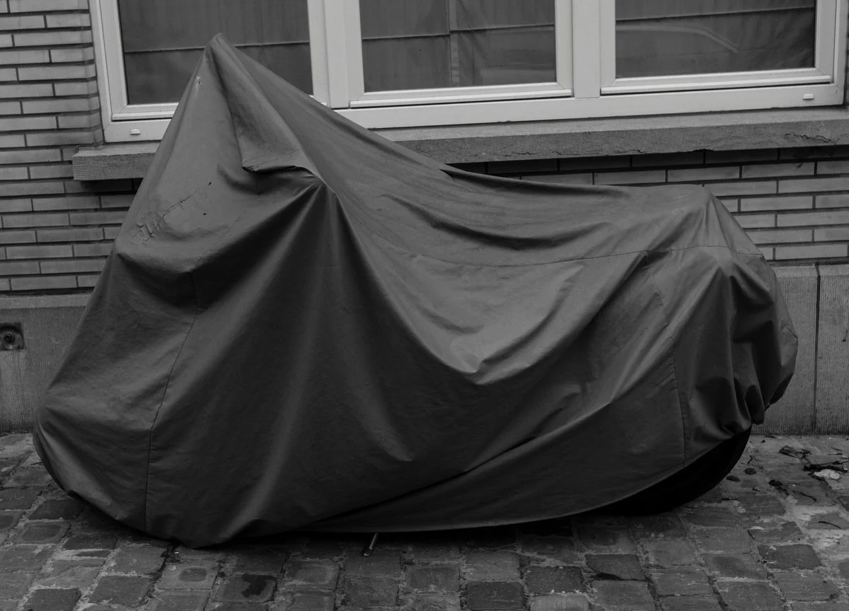 Photograph of a vehicle covered for protection