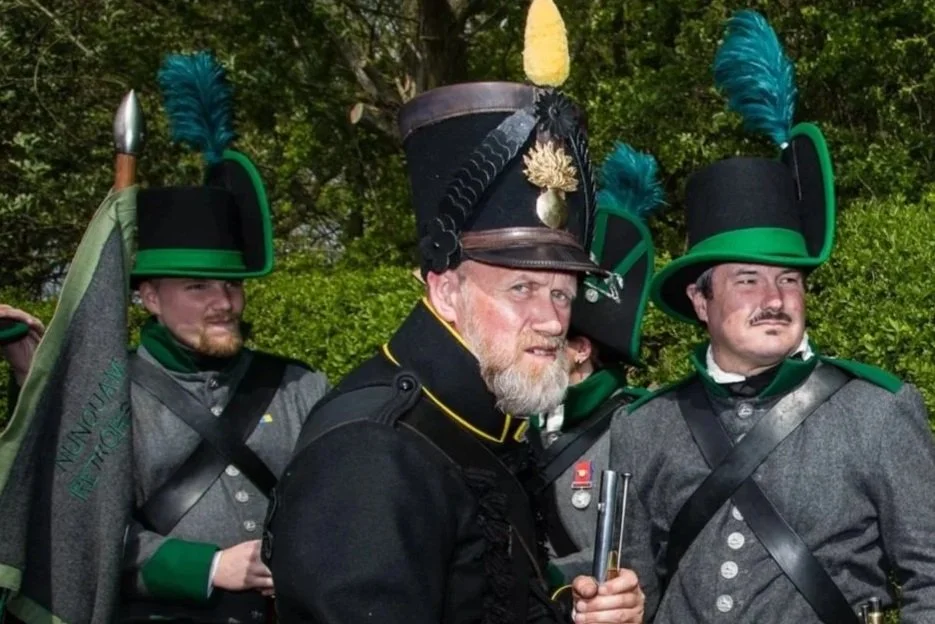 Picture of three reenactors replaying the battle of Waterloo