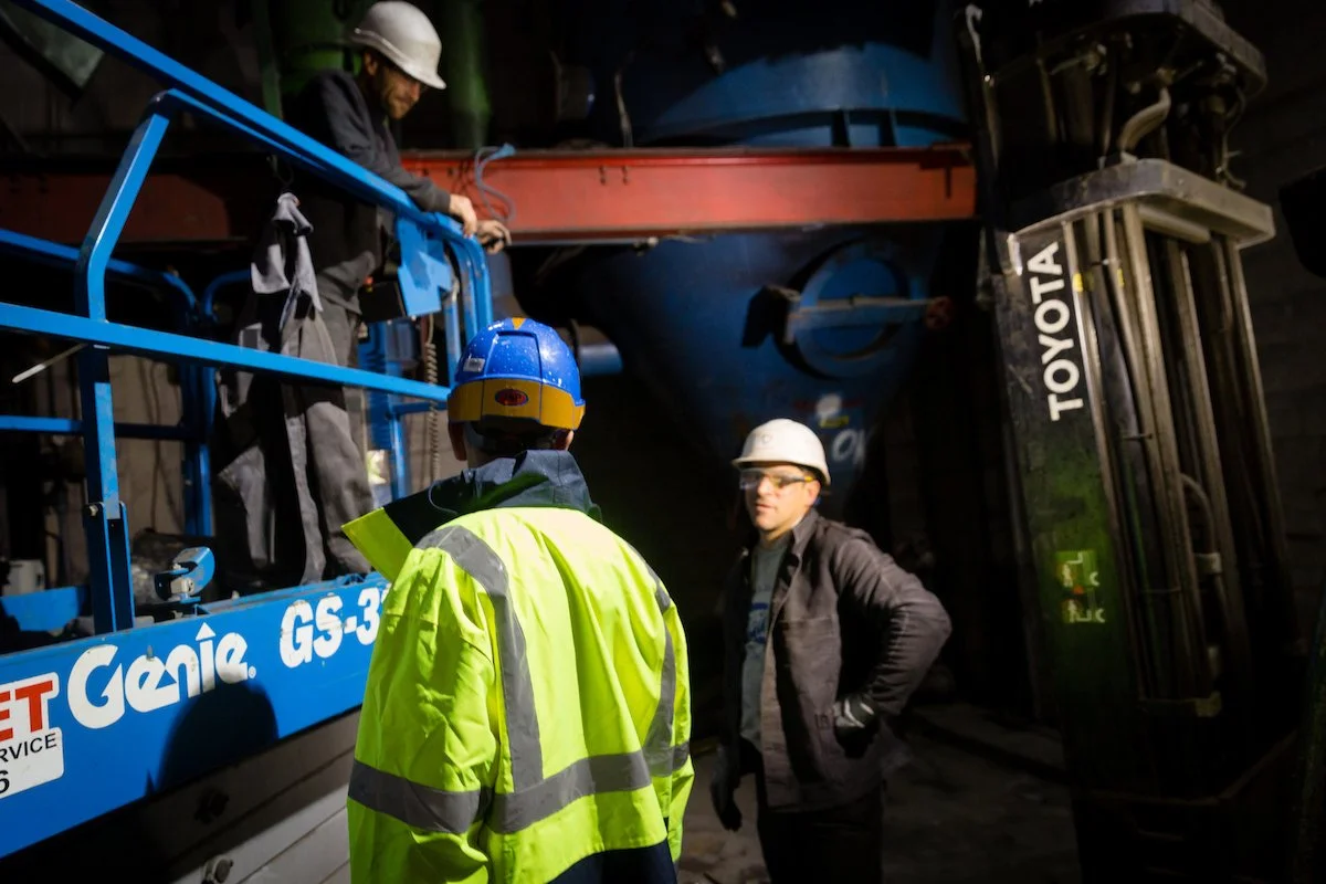workers talking in a factory