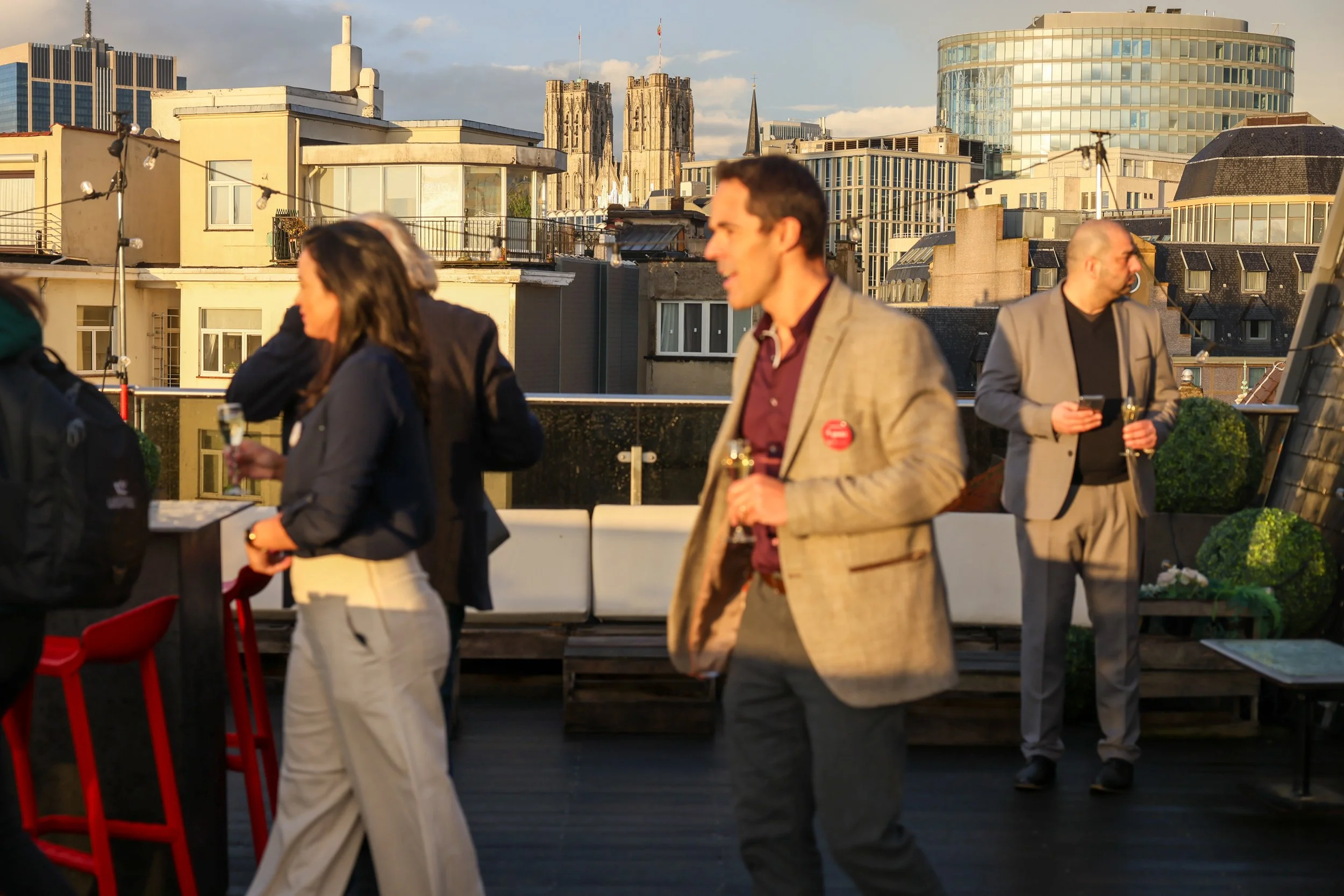 Rooftop people drinking at an event in brussels