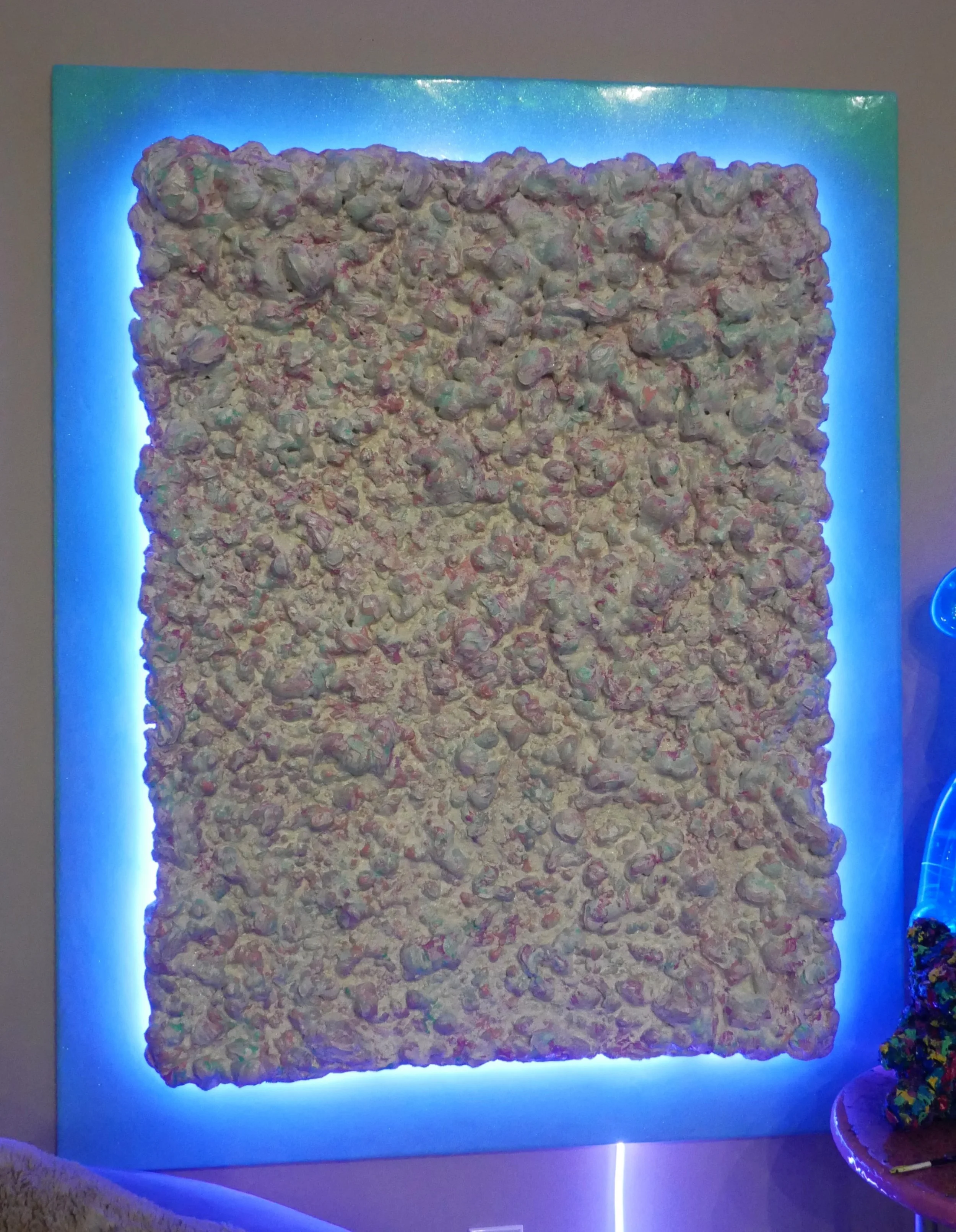 “The Arabella” –  60” H x 48” W x 5” D - Joint compound, acrylic, foam, polyacrylic, glitter, wood, resin, and LED changing light. 