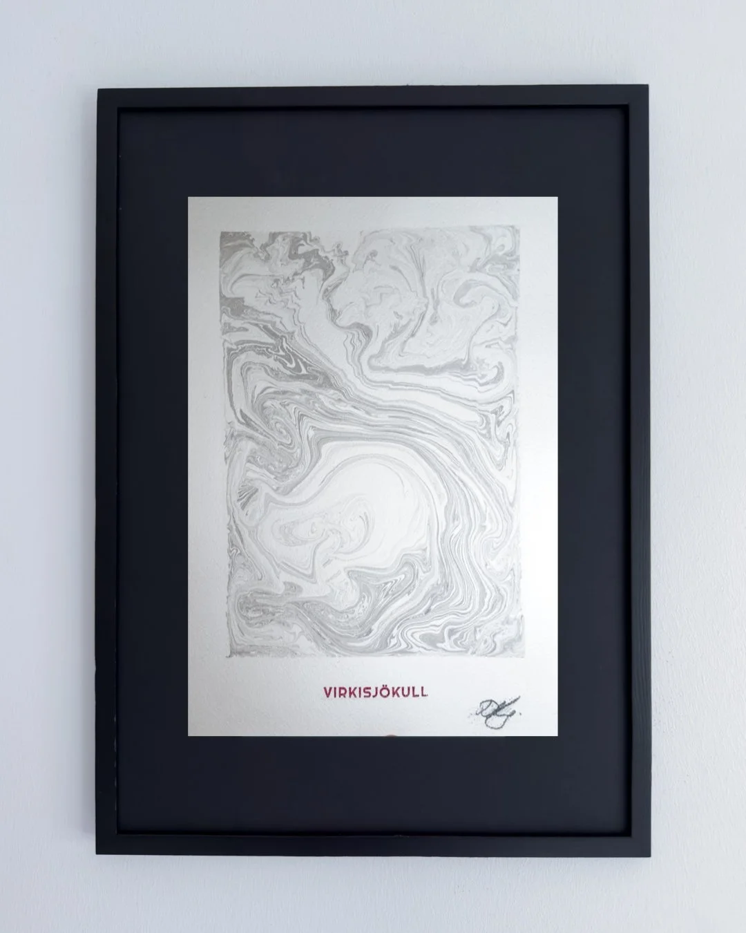 Framed black and white abstract art poster with the word 'Virksjǫkull' and a signature at the bottom right corner.