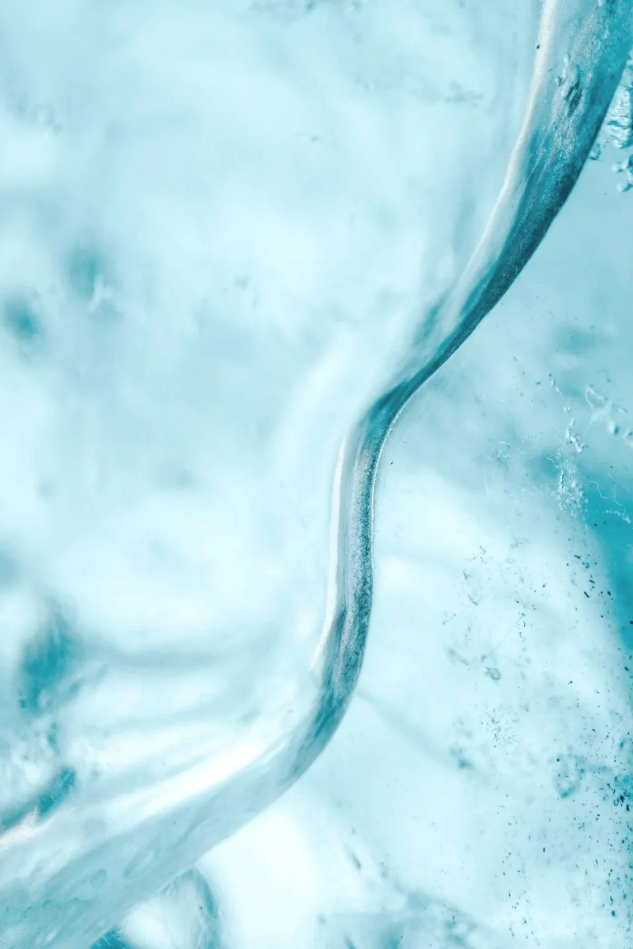 Close-up shot of a glacier ice with abstract stream pattern.