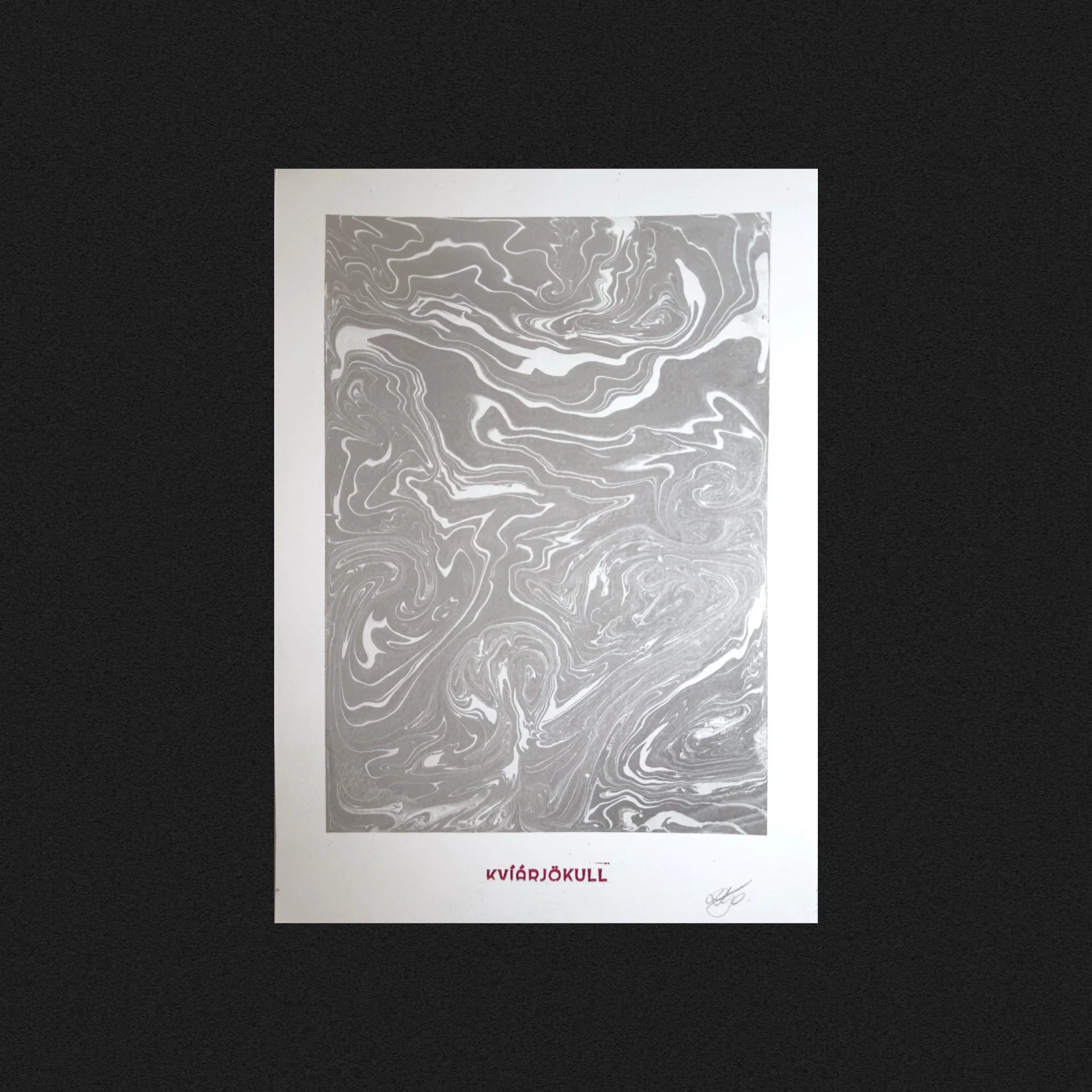 A grayscale marbled or swirl pattern paper with the word 'KVIÐARJÖKULL' in red and a signature below.