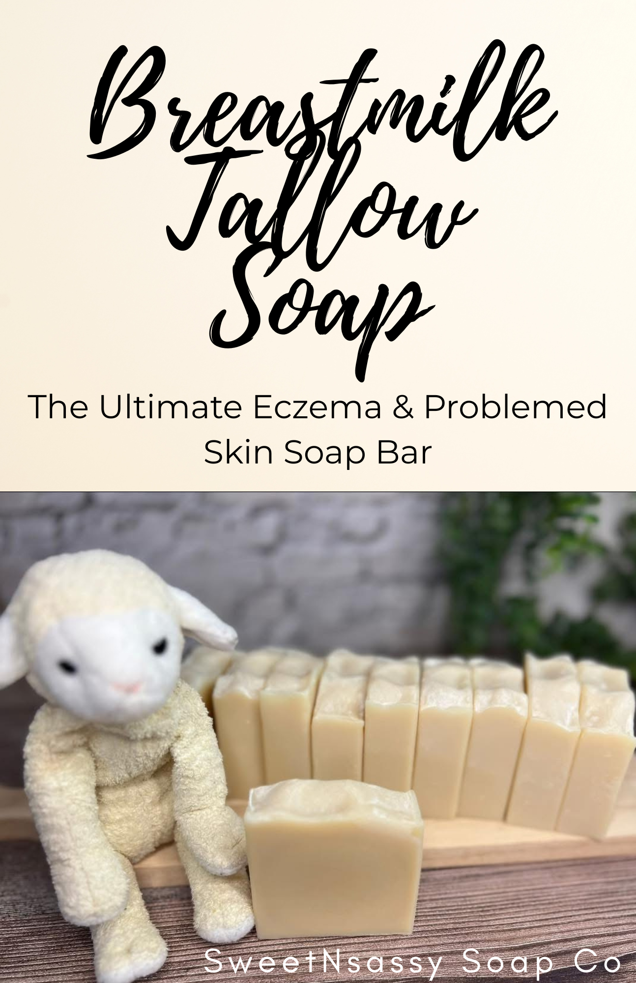 A display of tallow breast milk soap bars with a plush lamb toy sitting beside them, and a sign above reading "Breastmilk Tallow Soap". The sign mentions it is "The Ultimate Eczema & Problem Skin Soap Bar."