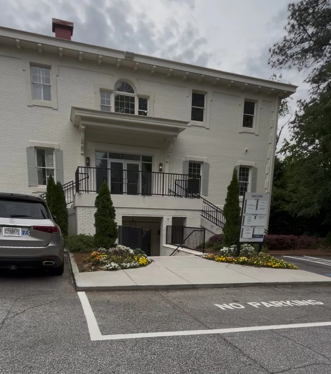 white-brick-building-entrance-parking.jpeg
