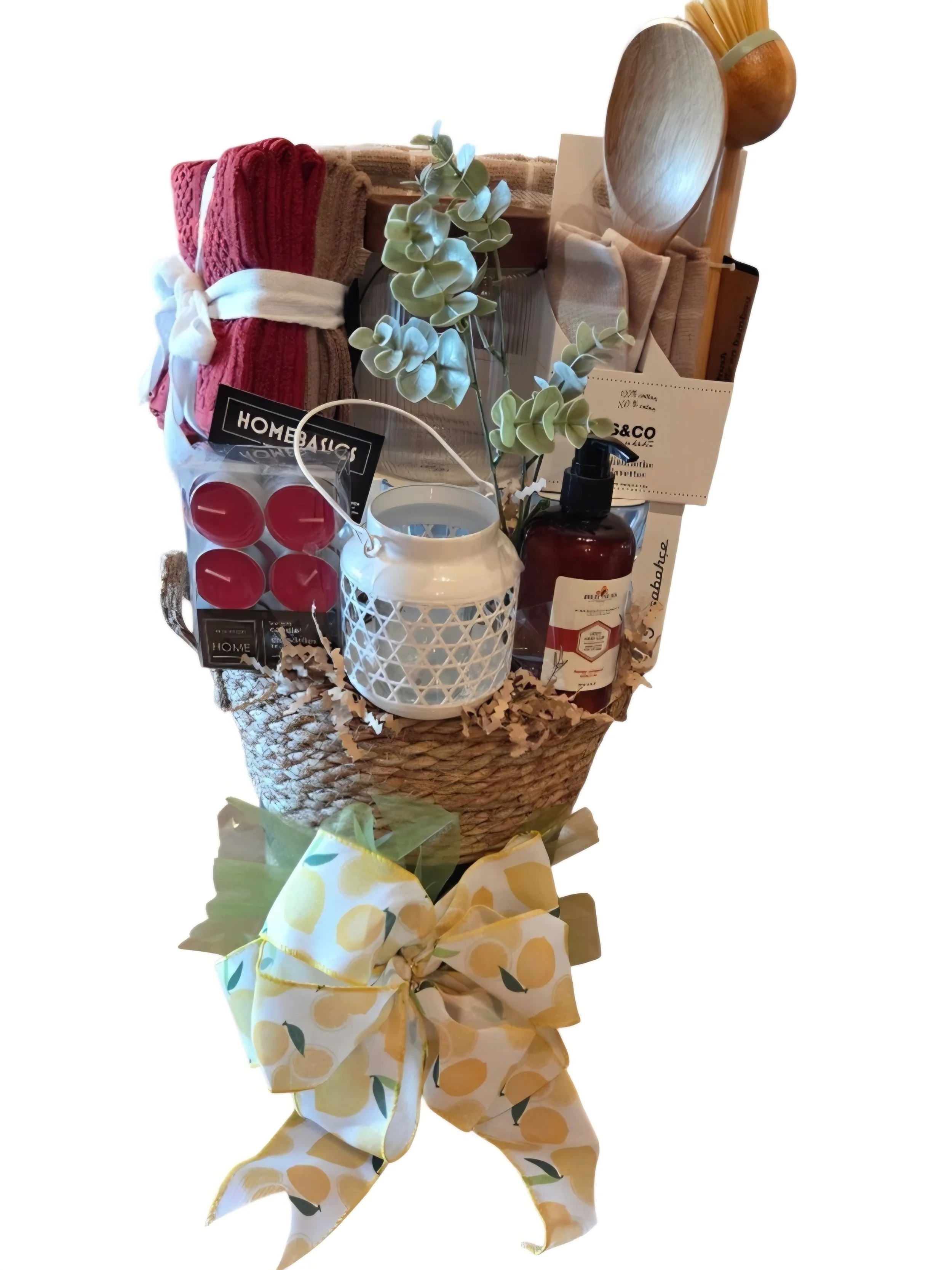 We chose soft neutral linens and wooden accessories for a natural feel. The gift includes an assortment of dishcloths, tea towels, a wooden spoon, wooden dish brush, glass storage container, 6 tumbler glasses, a lovely lantern with tealight candles,