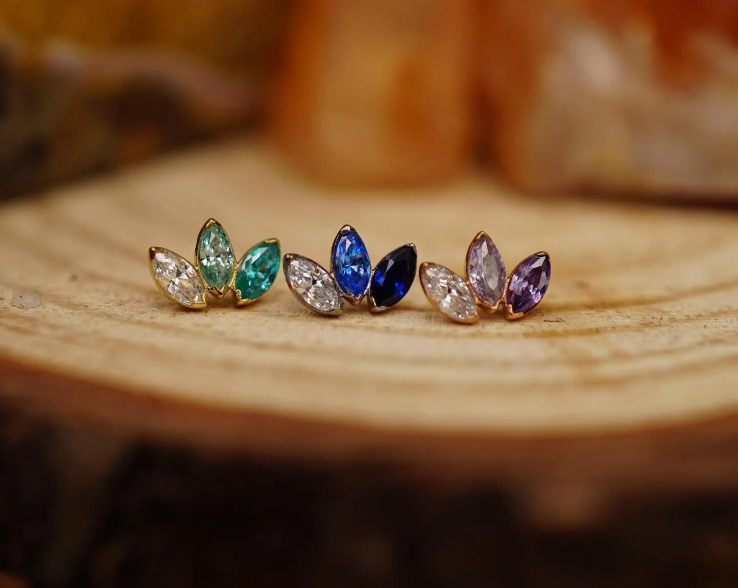 18k triple stone marquise fans from left to right: 

YG : white + pistachio + mint green CZ
WG : white + arctic blue + sapphire CZ 
RG : white + lavender + amethyst CZ 

#ceremonypiercing #safepiercing #workerowned #queerowned #finejewelry #goldjewel