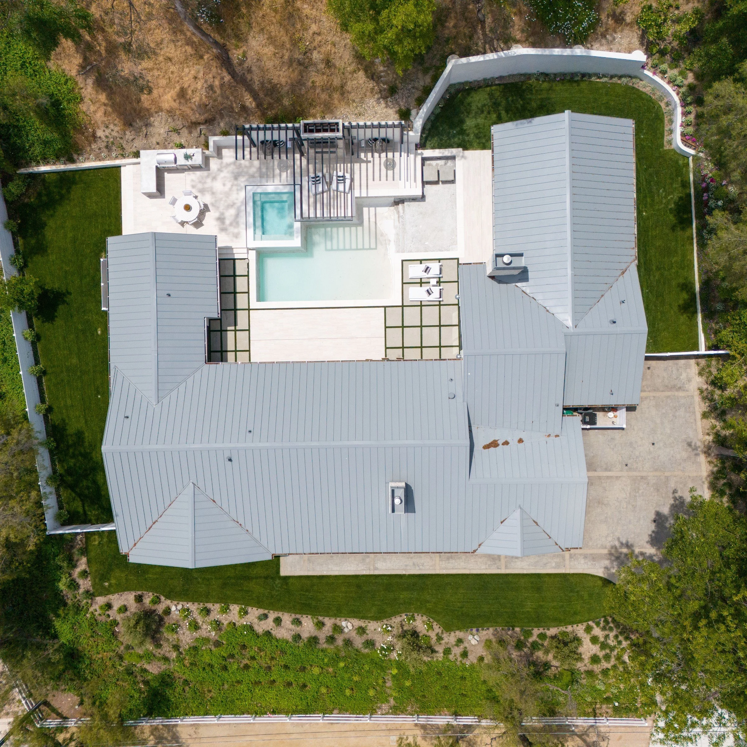 Calabasas-area home with standing-seam metal roof, aerial drone photography