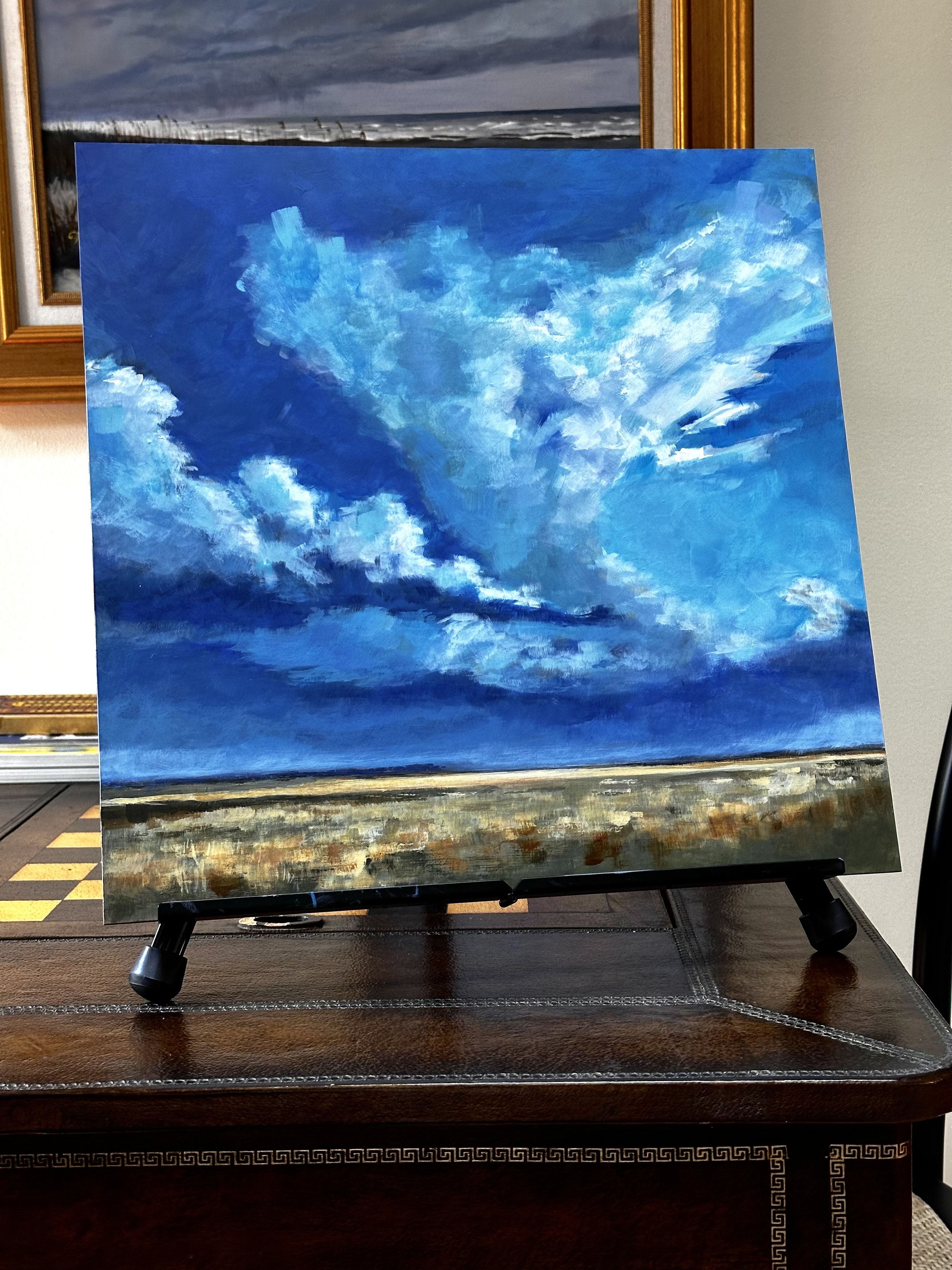 Landscape painting of an impending storm on the horizon, capturing the drama of dark clouds over open prairie or Lowcountry wetlands