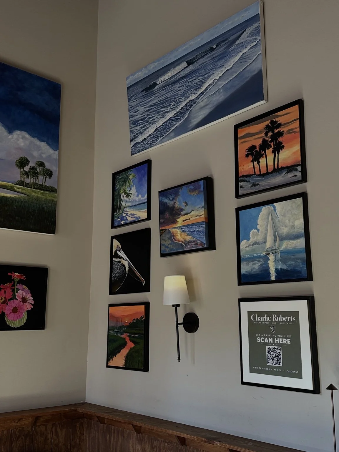 Charlie Roberts landscape paintings displayed at Cork Wine & Craft Cocktails in Southern Pines.