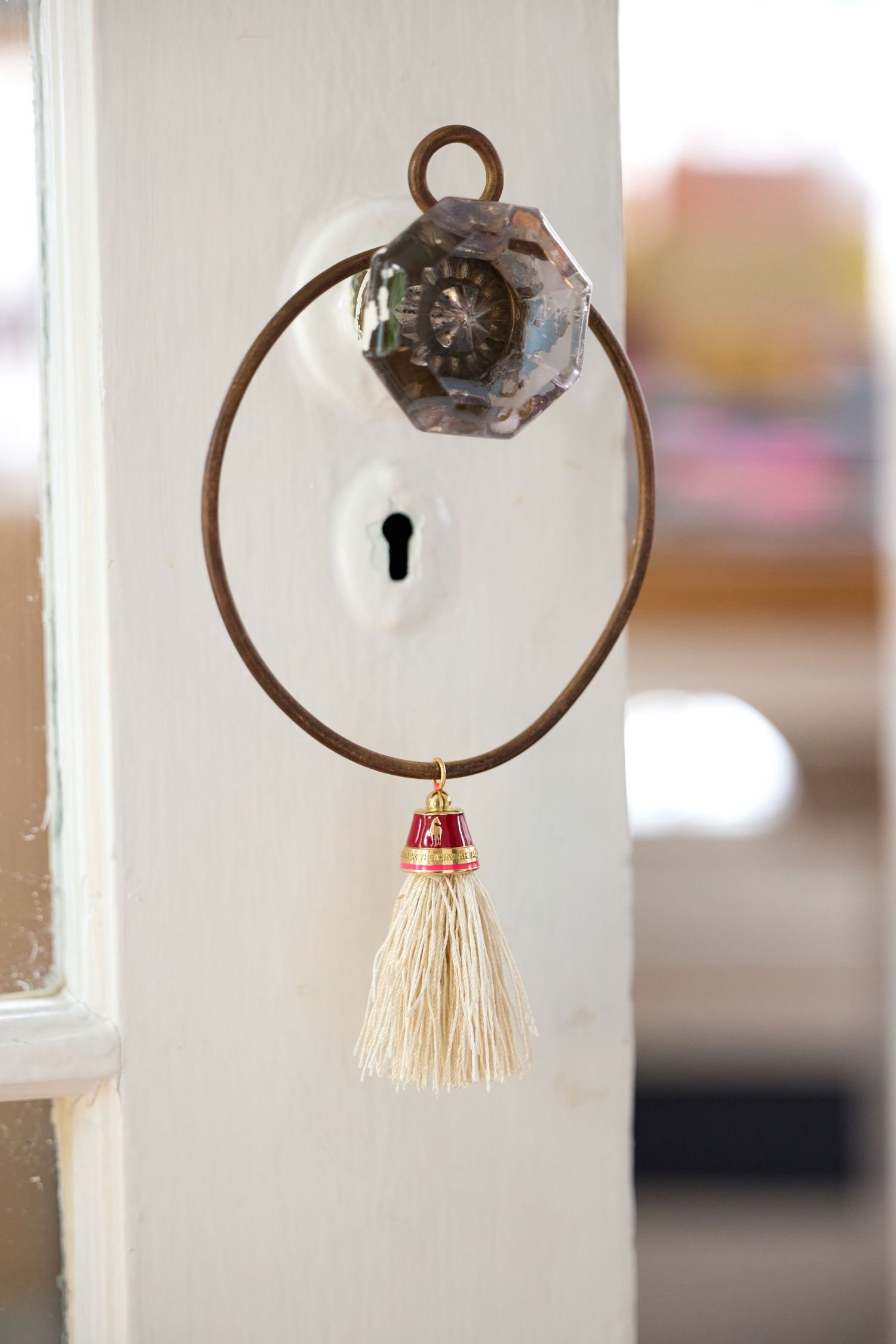 Style shot of Horse tassel pendant in 14K gold