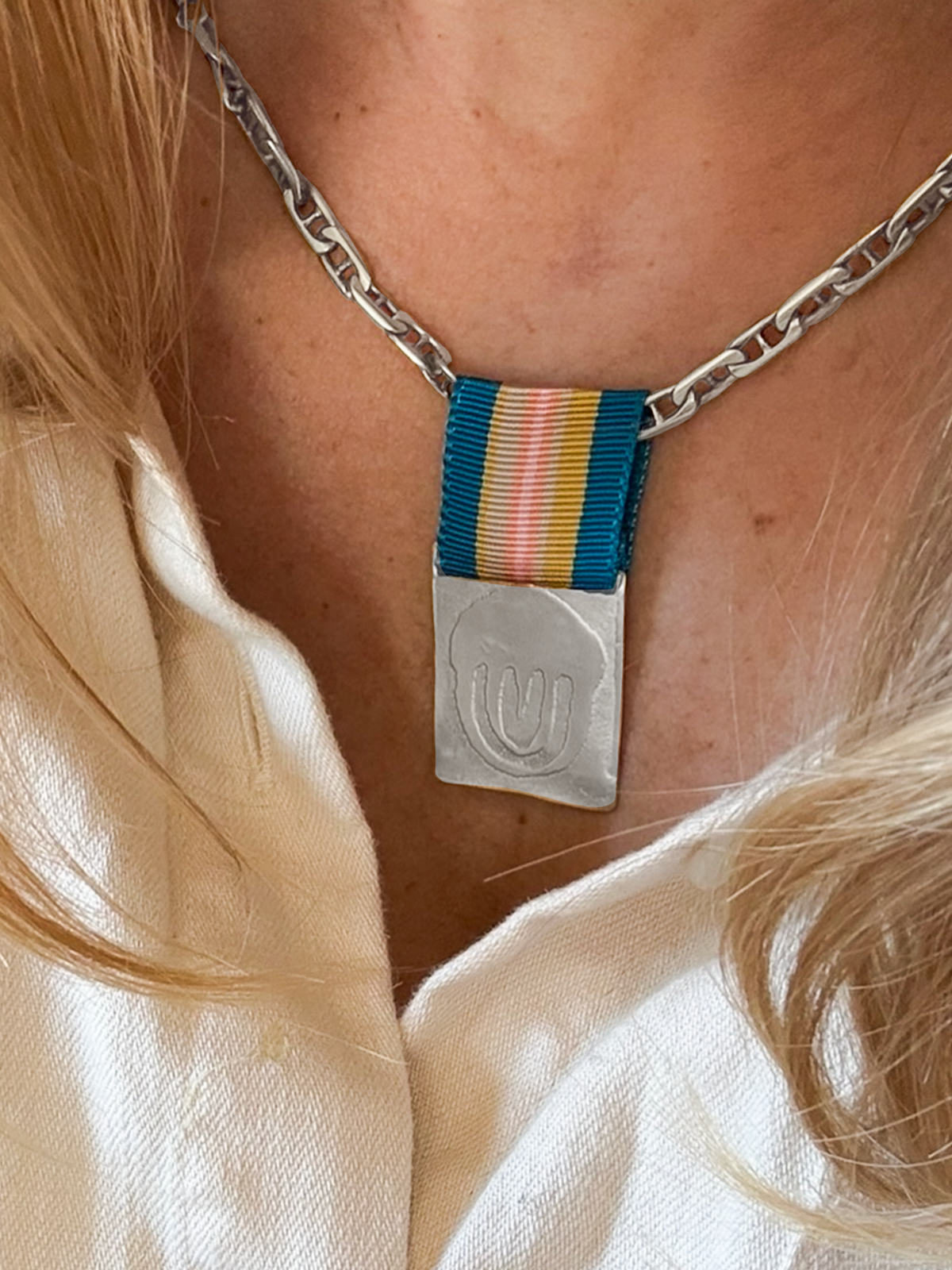 Sterling Silver Ribbon Pendant on Model by Elaine Chong Designs
