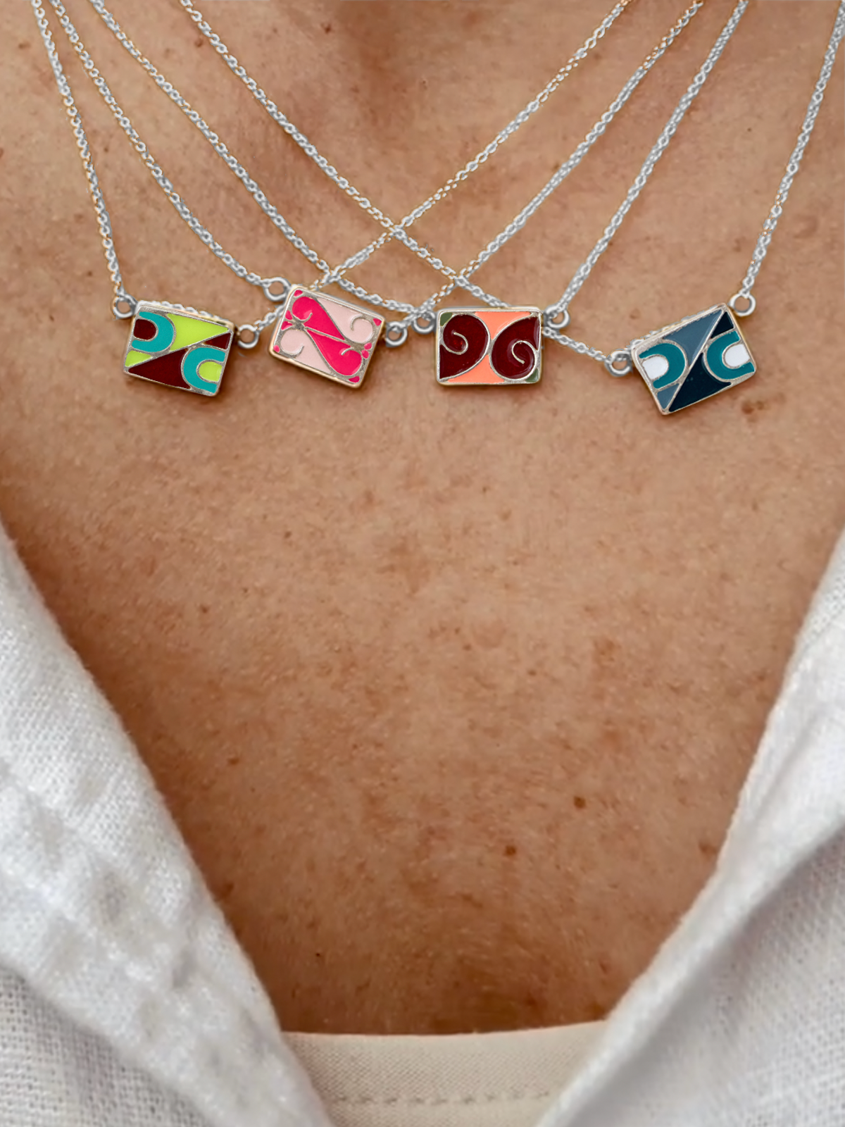 Sterling Silver Vintage Enamel Tiles on Sterling Silver Chains stacked on model, by Elaine Chong Designs