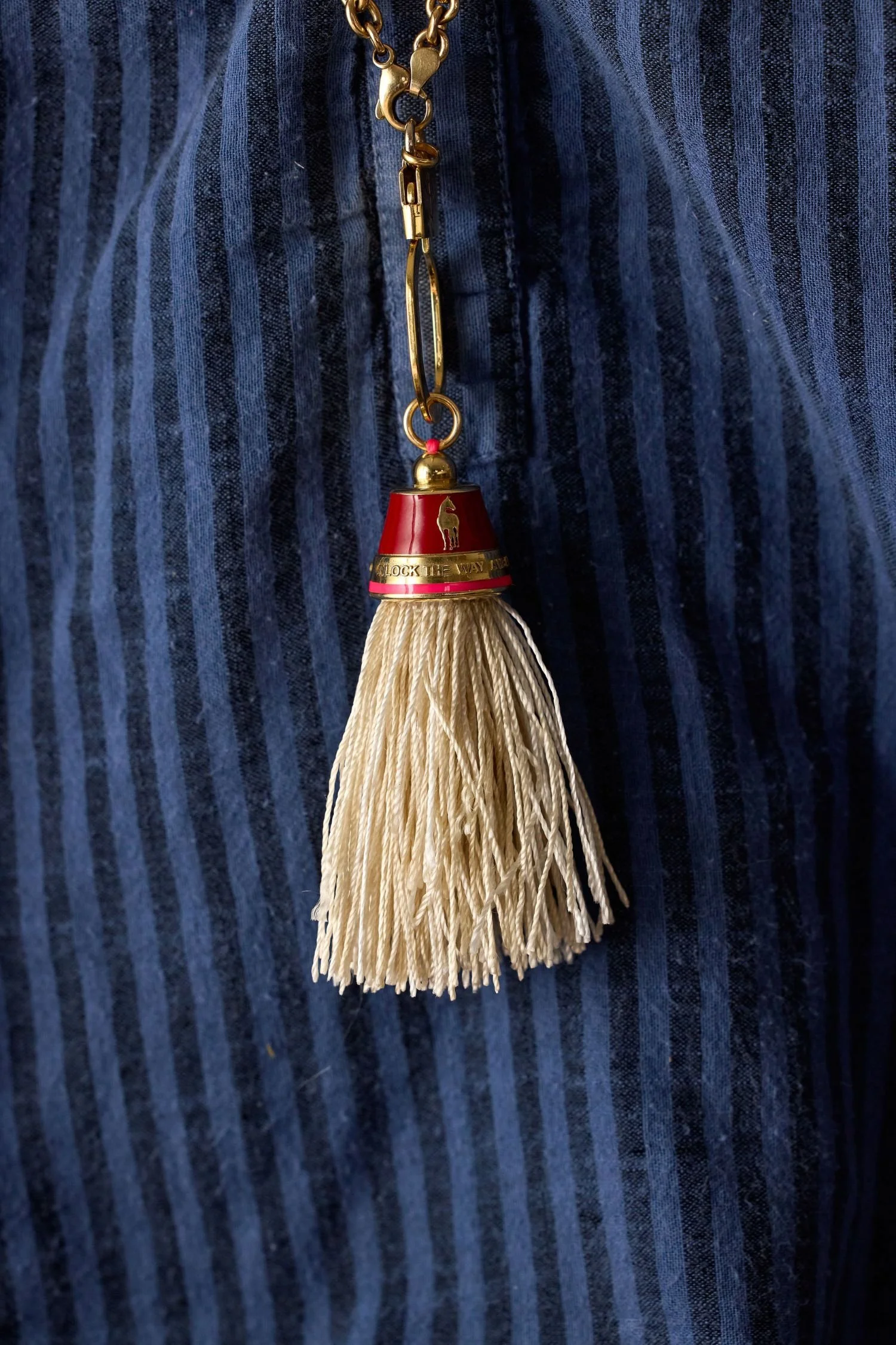 Horse tassel pendant worn on a necklace