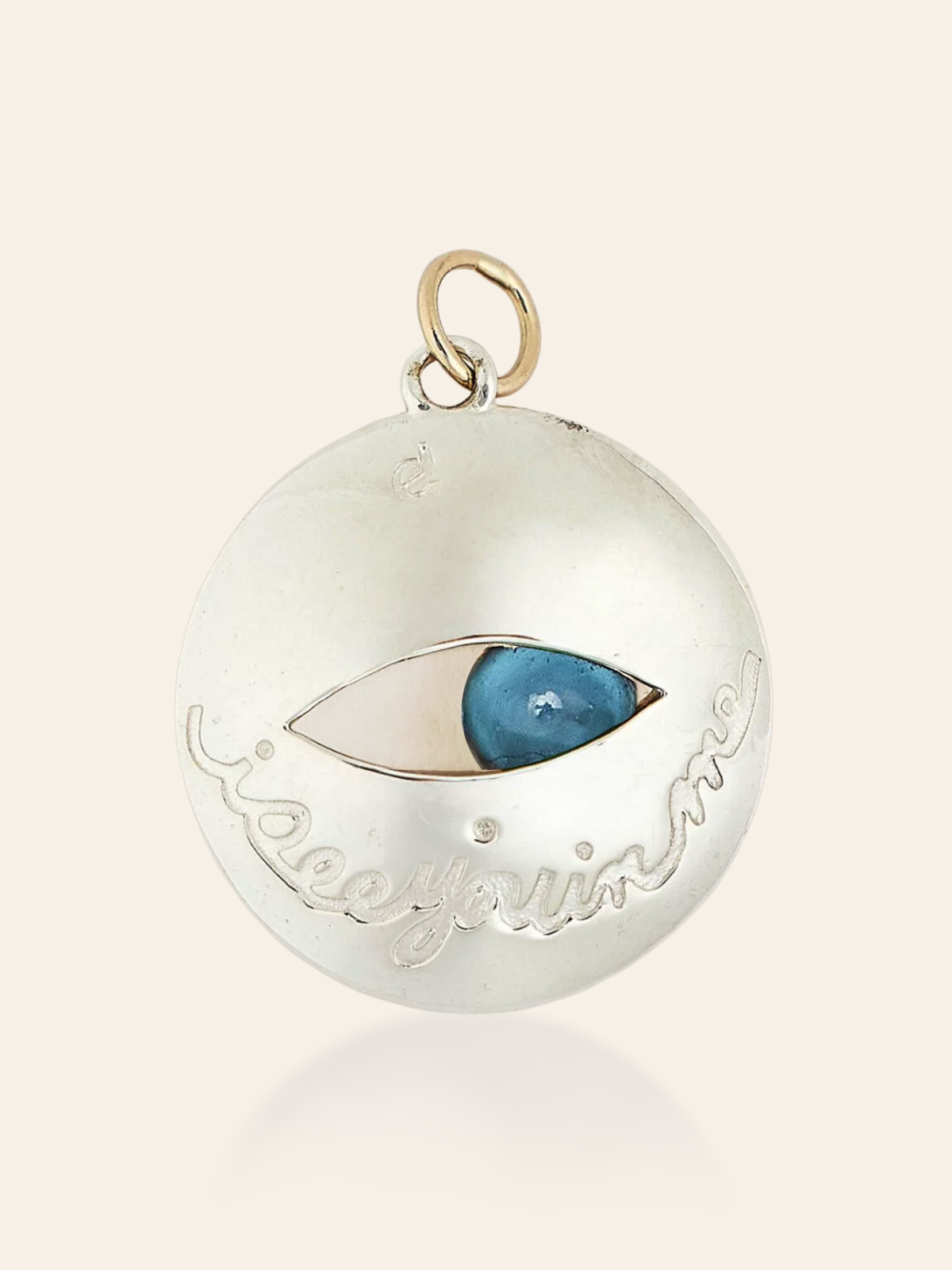 pendant-movingeye-mixedmetal-LBT.pngMixed Metal Eye Pendant in 14K Gold and Sterling Silver with Moving Gemstone, London Blue Topaz (back) by Elaine Chong Designs