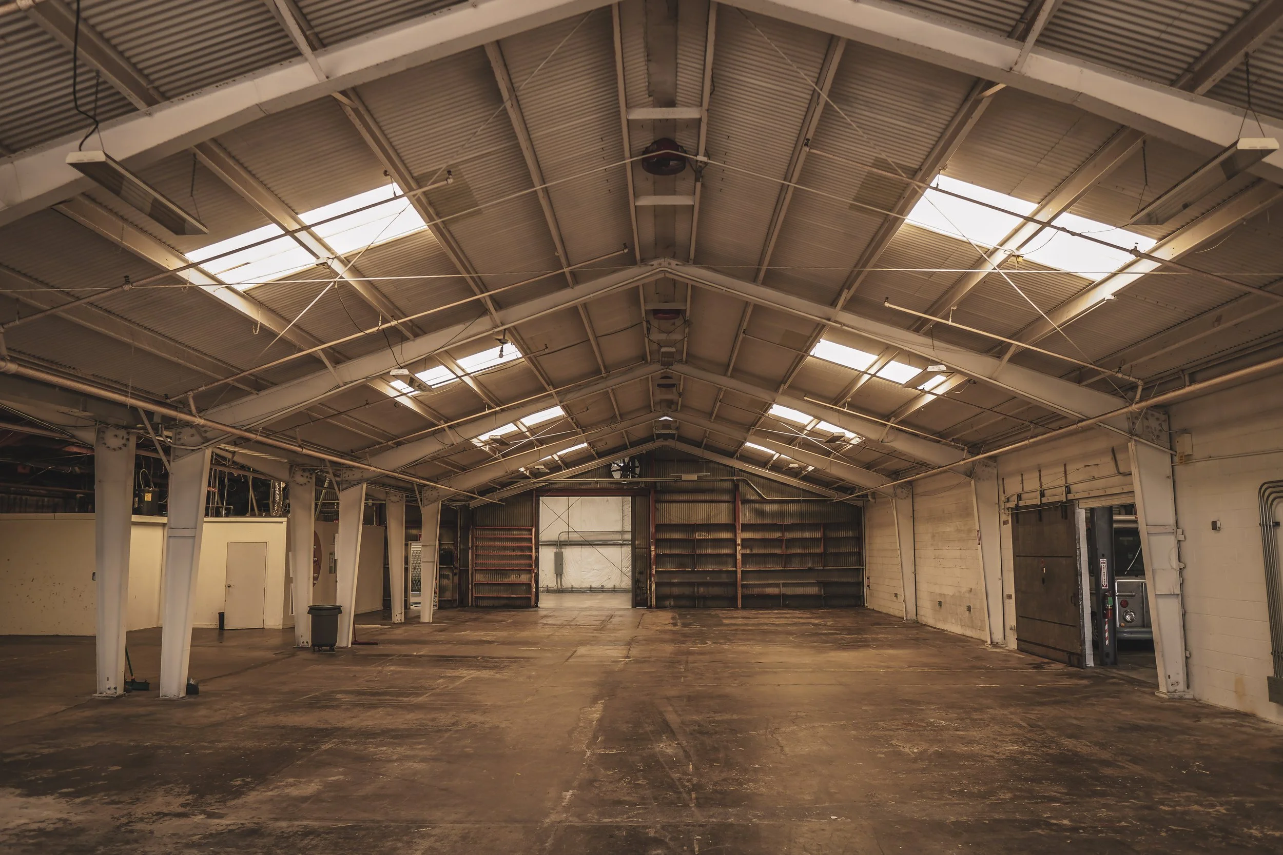 Empty industrial warehouse with high ceiling, specially designed for secure climate controlled car storage.
