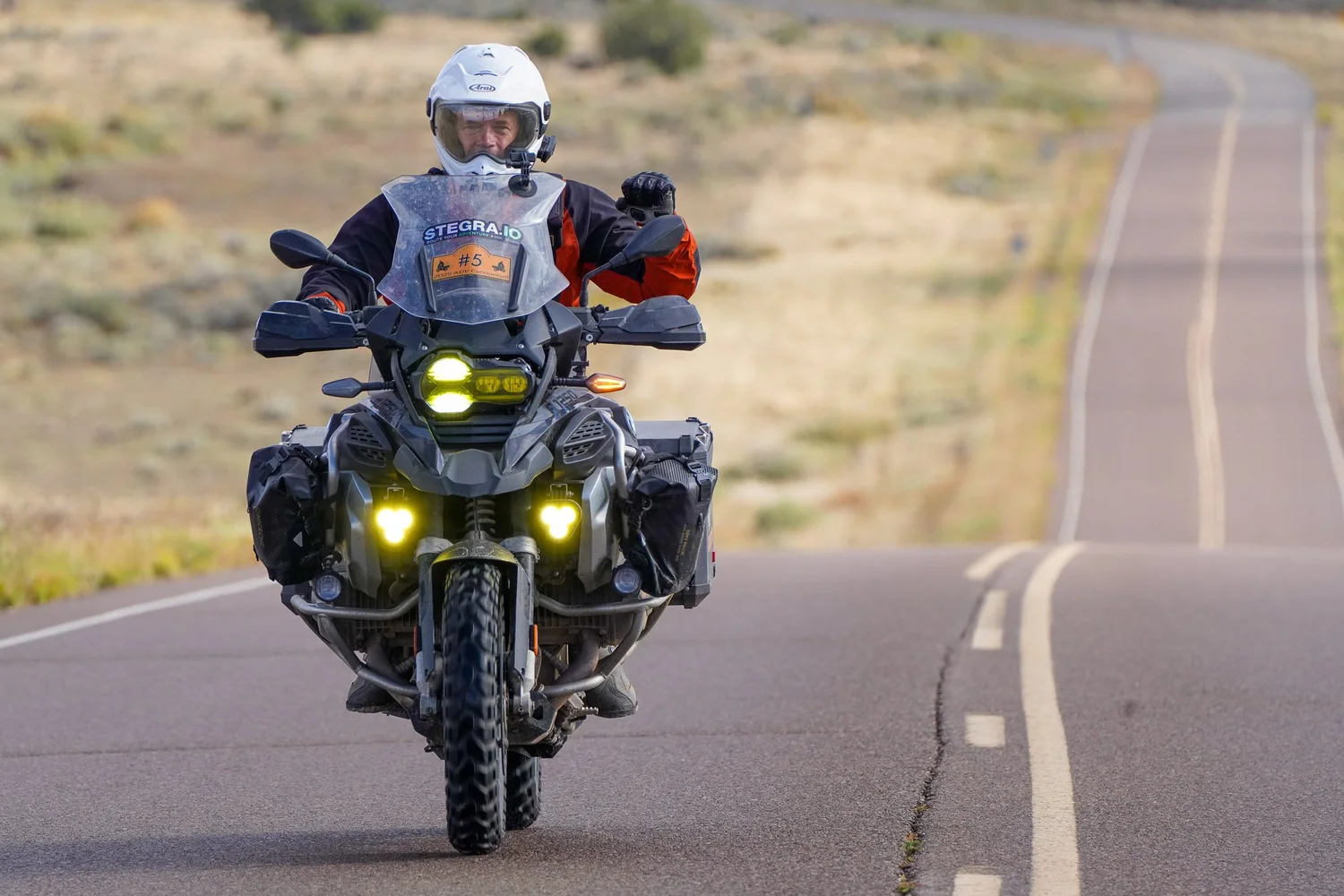 Adventure motorcycle on a winding desert road