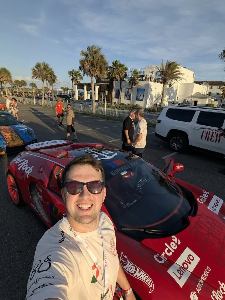Tommy Davies takes a selfie with the Bugatti Veyron at the Gumball 3000 start line in Miami
