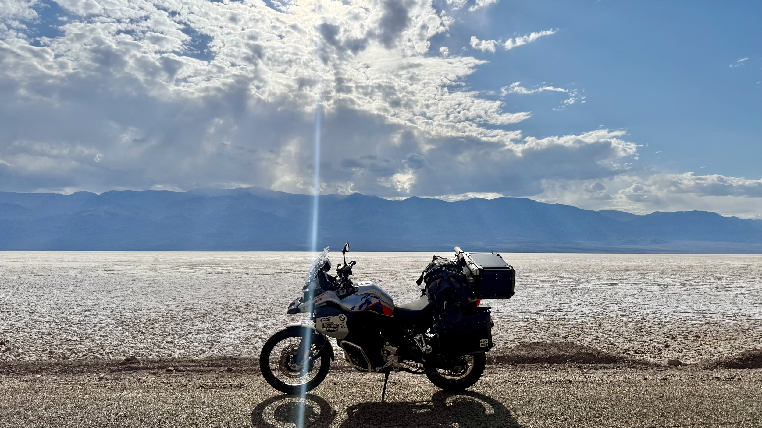 Motorcycle crossing a salt flat during ADV Cannonball route scouting