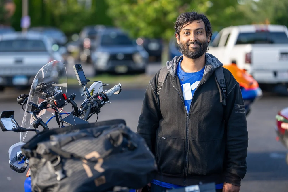 Sahil Panwar standing beside his Yamaha WR250R before the start