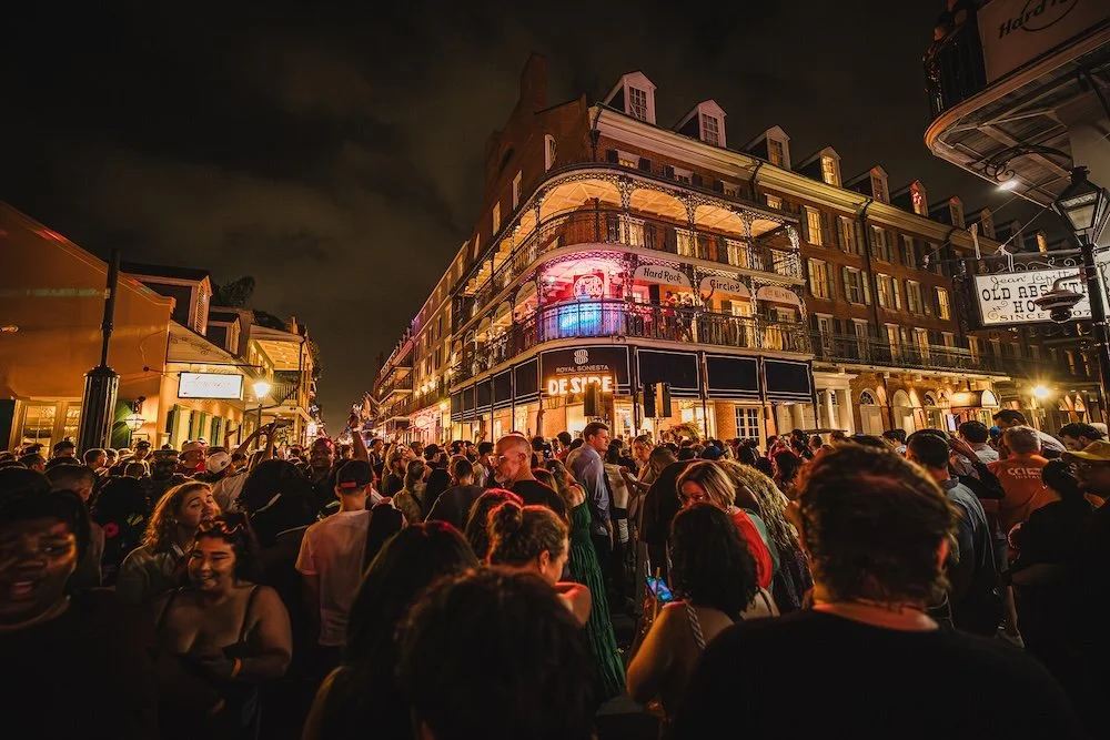 Thousands of fans line a closed off Bourbon Street in New Orleans for the Gumball 3000 street party