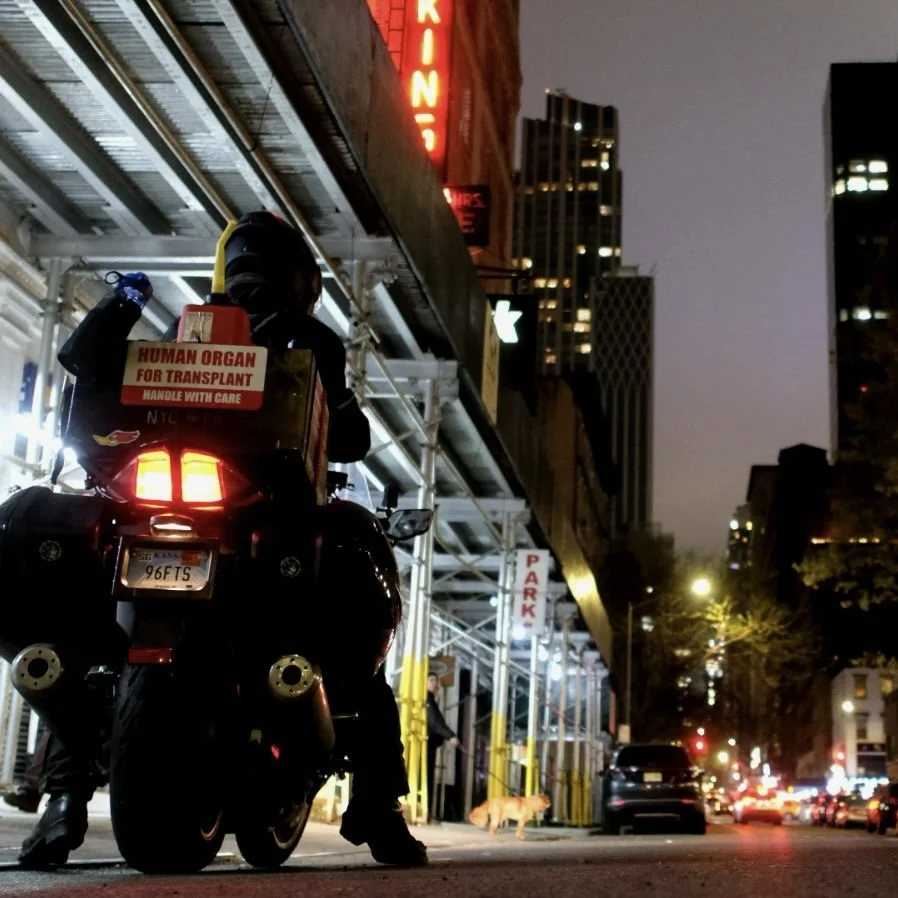 Beau Earnest departing the Red Ball Garage on his record-setting motorcycle run.