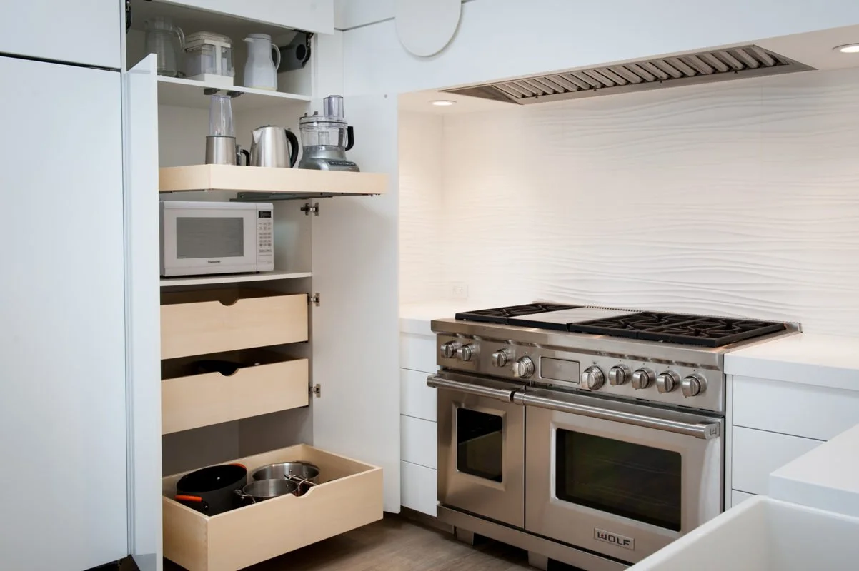 pantry cabinet with microwave shelf and roll-out shelves