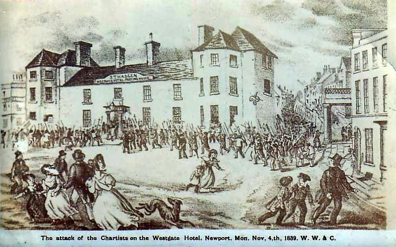 From Wikipedia. Image shows a large group descending on a town, weapons raised. The attack of the Chartists on the Westgate Hotel, Newport. Mon Nov 4, 1839