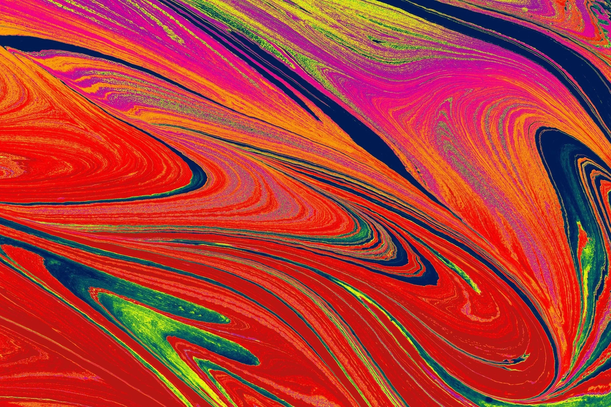 Abstract colorful swirling pattern in bright red, purple, green, and black hues.
