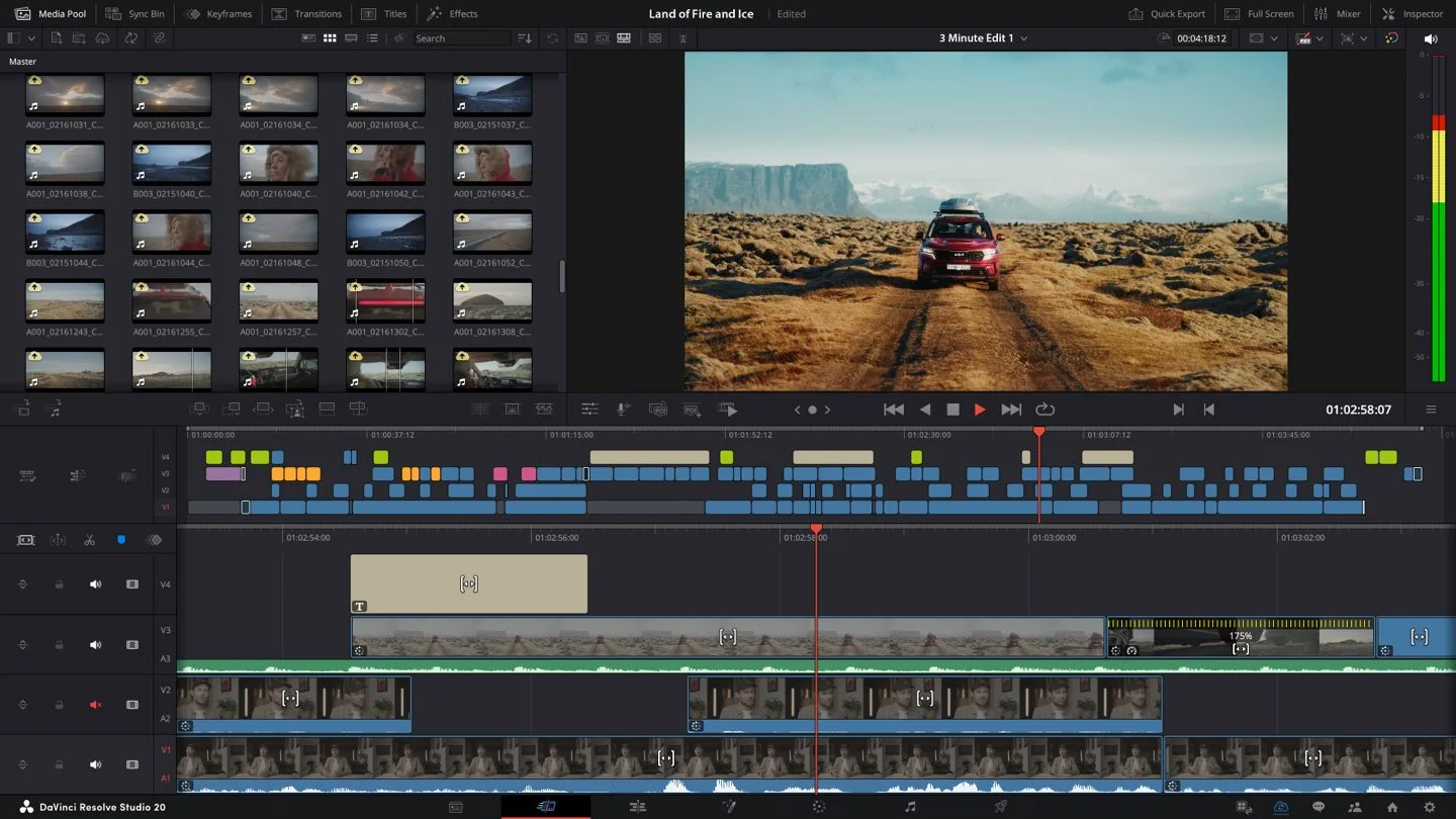 Video editing software screen showing a landscape scene with a red car driving on a dirt road through a dry, rugged terrain, with mountains in the background and a partly cloudy sky.