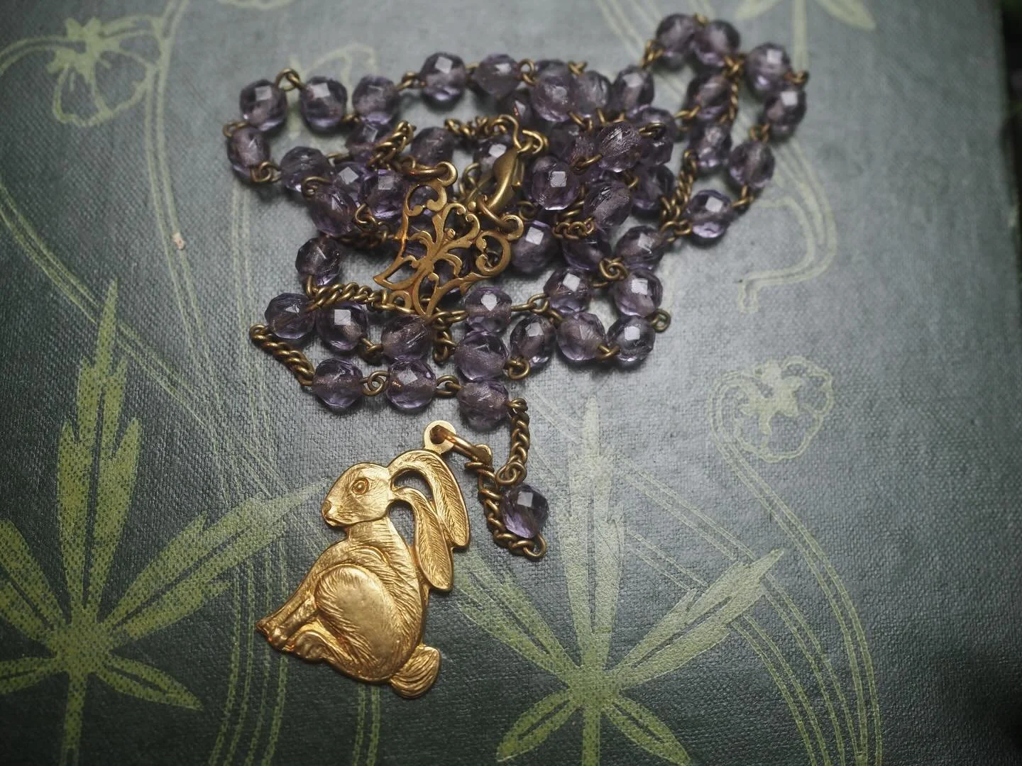 Three new upcycled rosary necklaces

The first a hare, made for St Melangell - Welsh patron Saint of Hares. Very delicate (in appearance not strength) vintage purple glass beads

2nd for Brighid - made at Imbolc - a little silver tone Brighid&rsquo;s