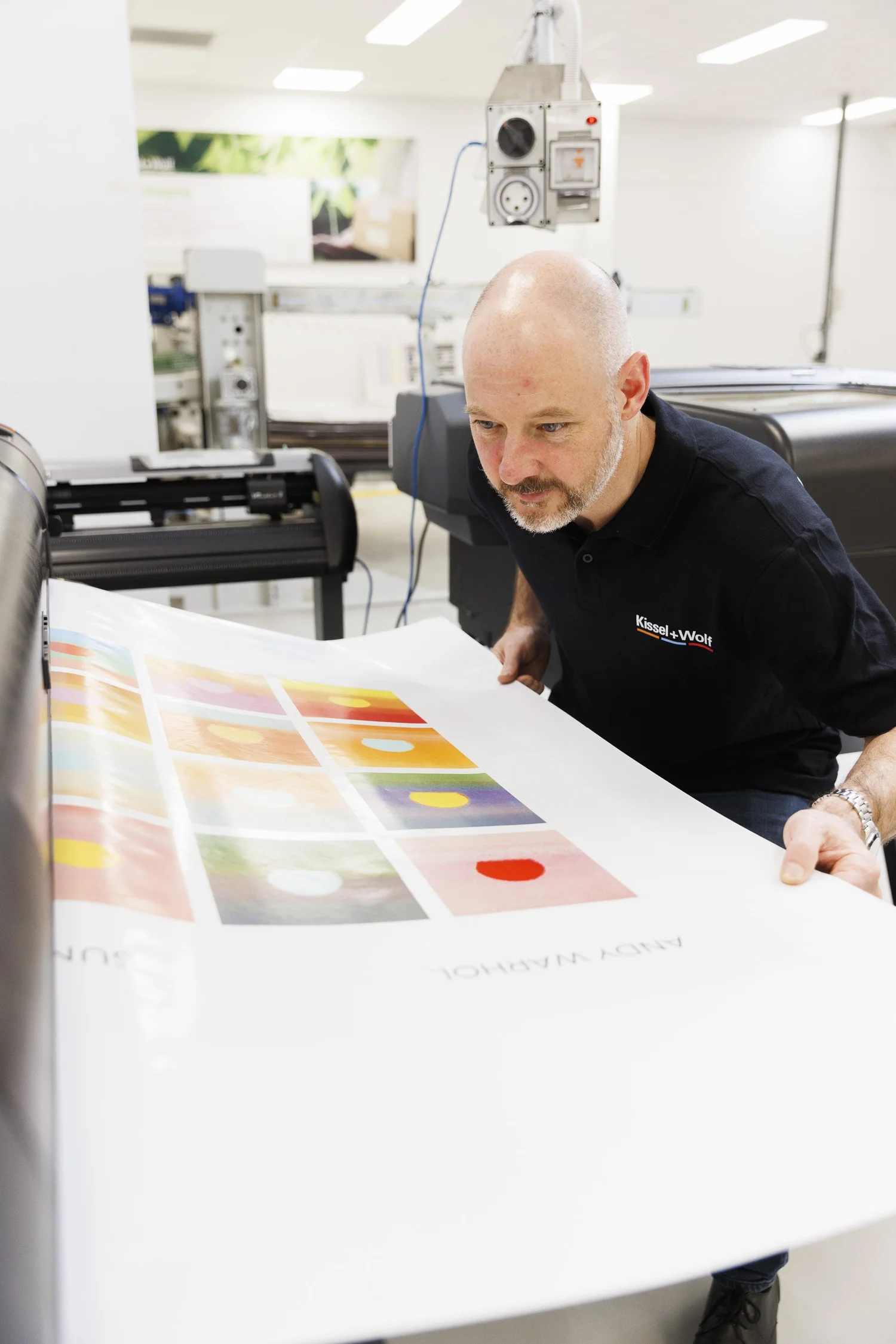 Kissel+Wolf specialist reviewing a print