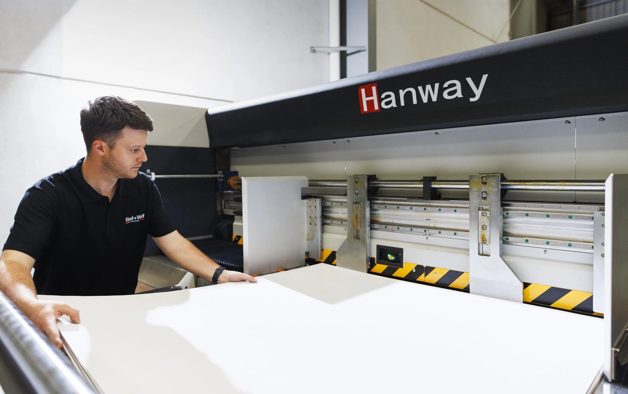 Hanway digital corrugated printer with operator showing integrated packaging production workflow and system alignment