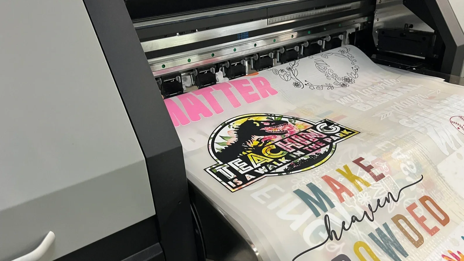 DTF printer producing transfer film as part of a complete Direct-to-Film production workflow using compatible inks, film, and consumables