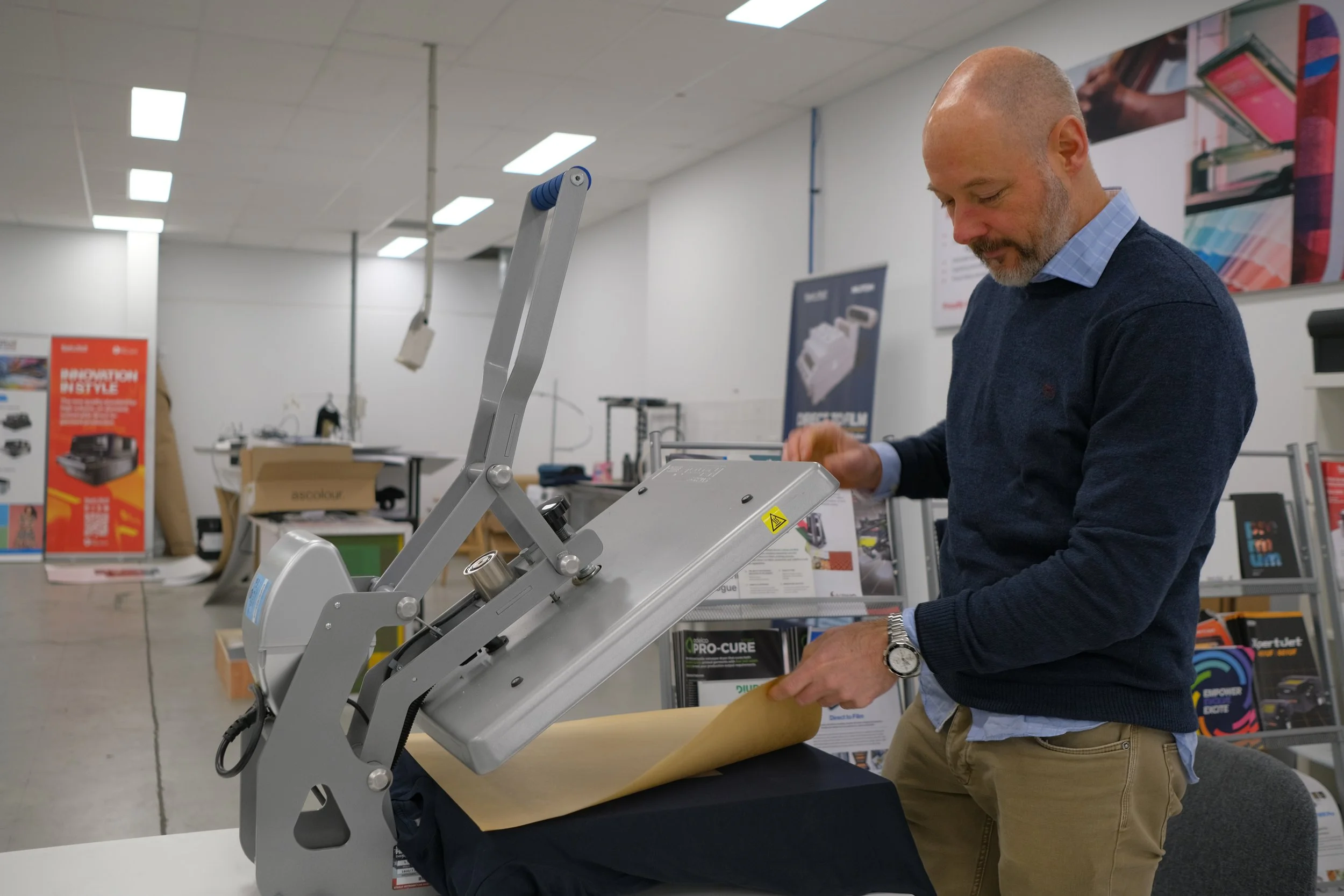 heat press for DTF printing applying transfer onto fabric to ensure proper adhesion and durable output