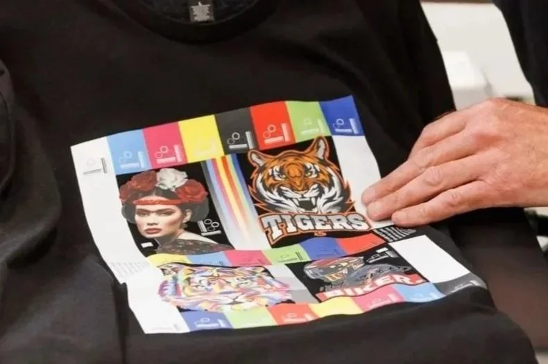 Completed DTF transfer applied to garment, demonstrating how ink, film, and adhesive powder work together to produce sharp detail, strong adhesion, and consistent colour output.