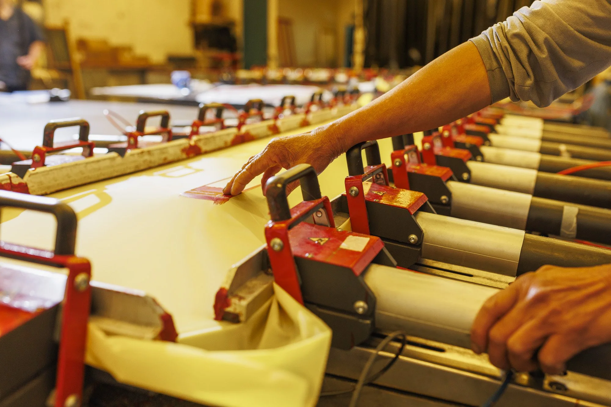 screen printing multi station press setup showing alignment and registration control for multi colour printing