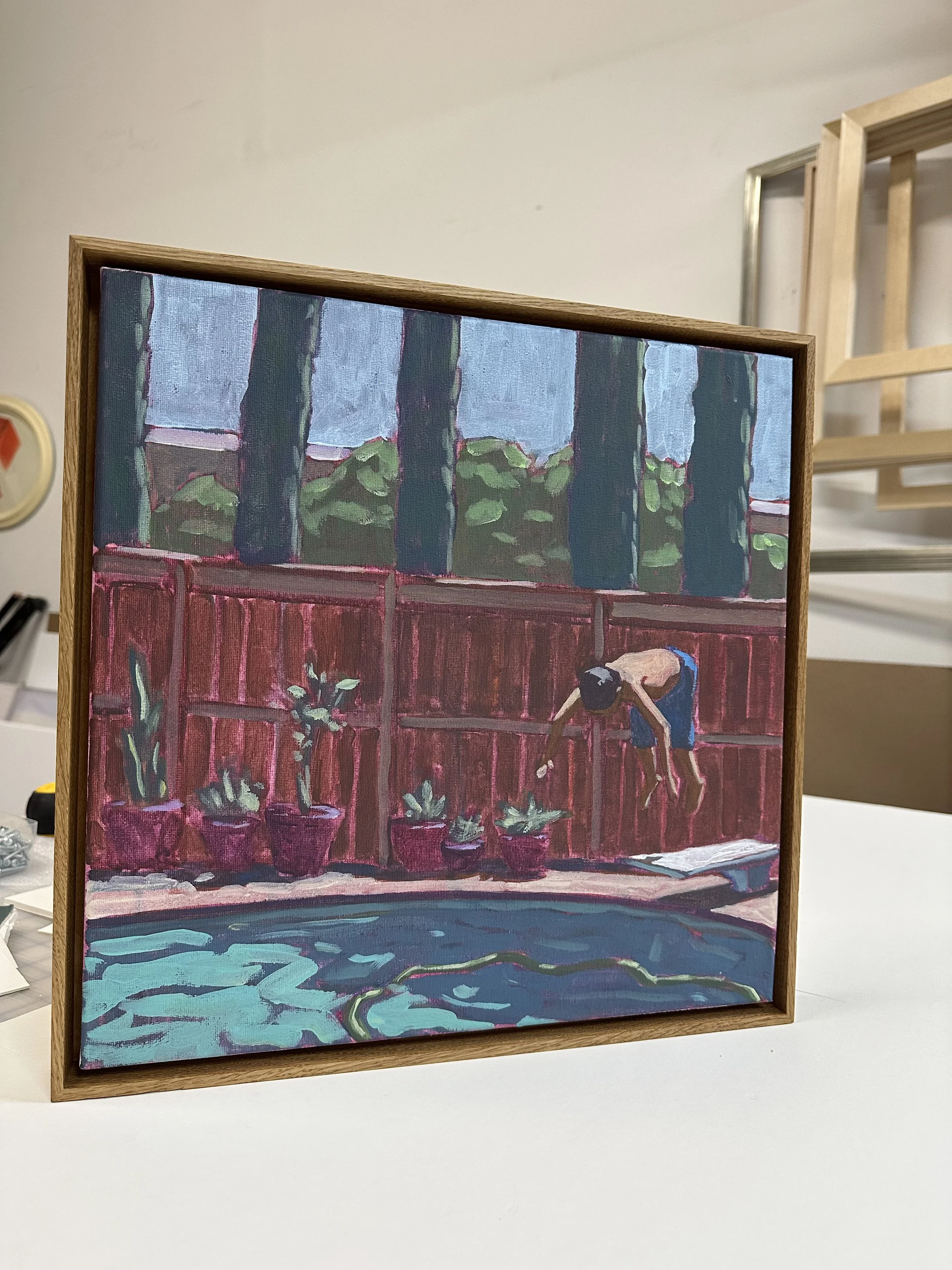 Canvas framed in a white oak floater.