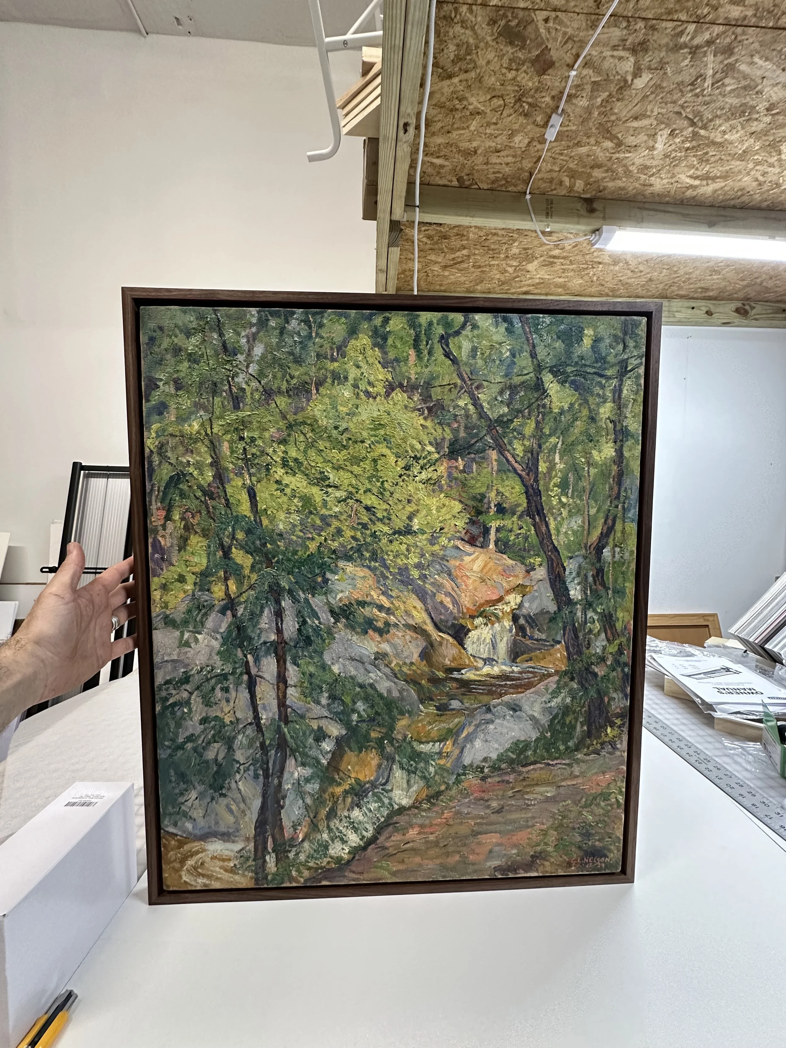 Canvas framed in a walnut floater.