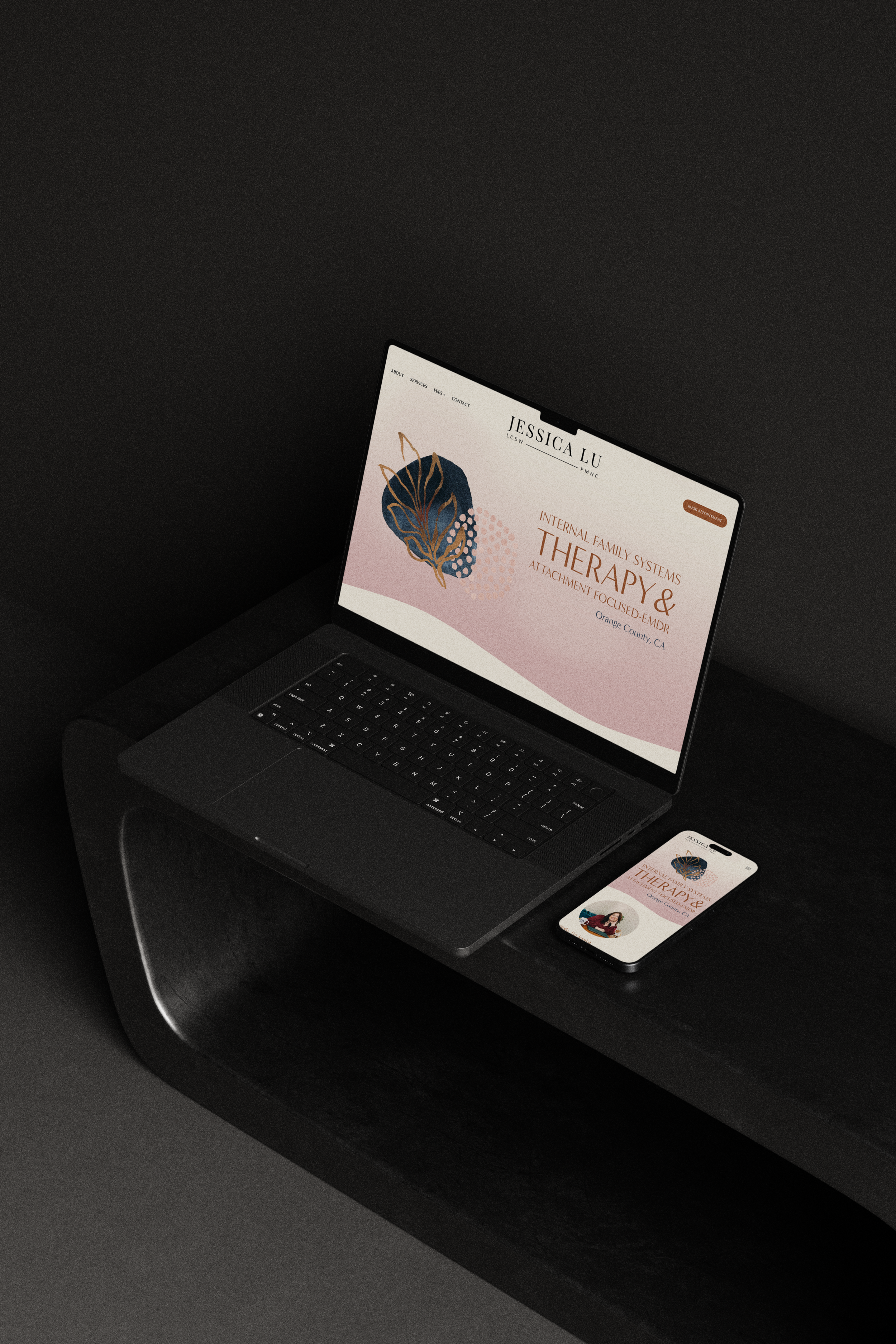 black computer and iphone showcasing therapist website design
