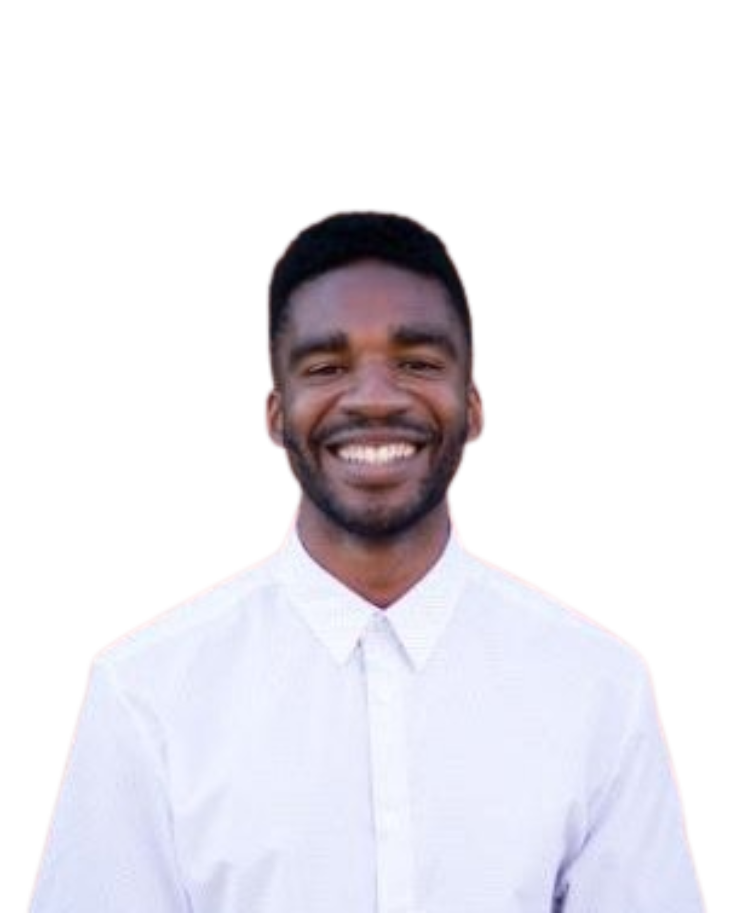 A smiling man with dark hair, beard, and brown skin, wearing a white button-up shirt.