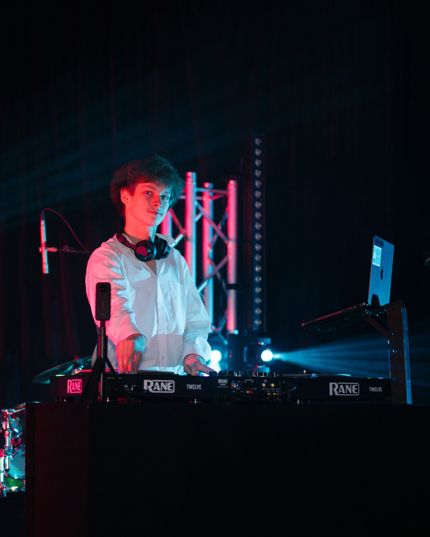 DJ Luca playing a live set on Rane decks under red and blue stage lights